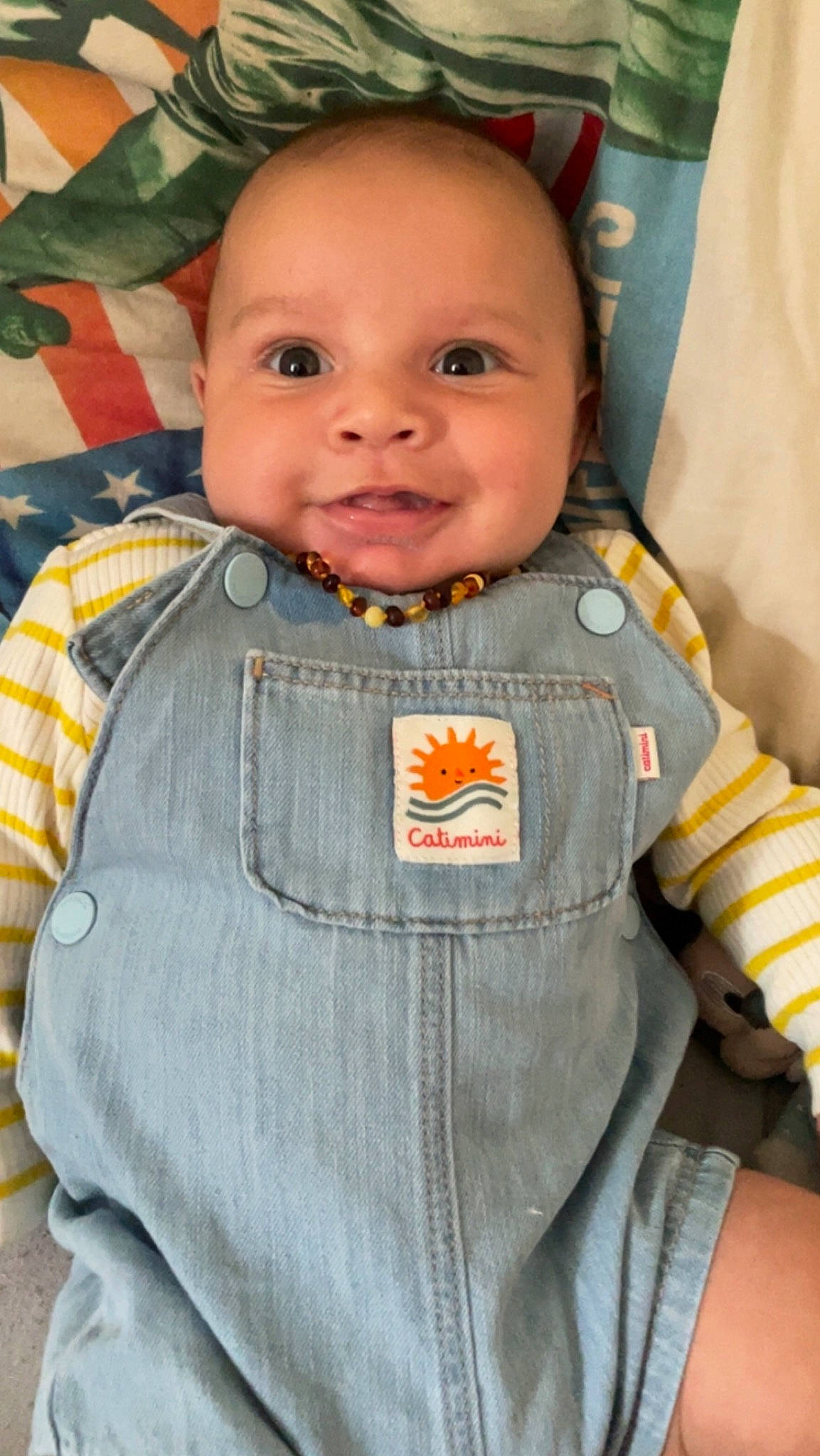 Eddy participe au concours pour gagner de l'argent avec cette photo : baby, baby_products, baby_toddler_clothing, button, cheek, child, collar, face, happy, head, jacket, joy, linens, nose, orange, outerwear, person, seat_belt, skin, sleeve