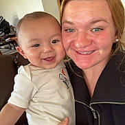 Klayten joined the competition — help win amazing prizes! baby, child, woman, smile, happy, indoor, person, clothing, holding, face, jacket, home, furniture, door, hand, skin, head, eyebrows, eyes, cheeks