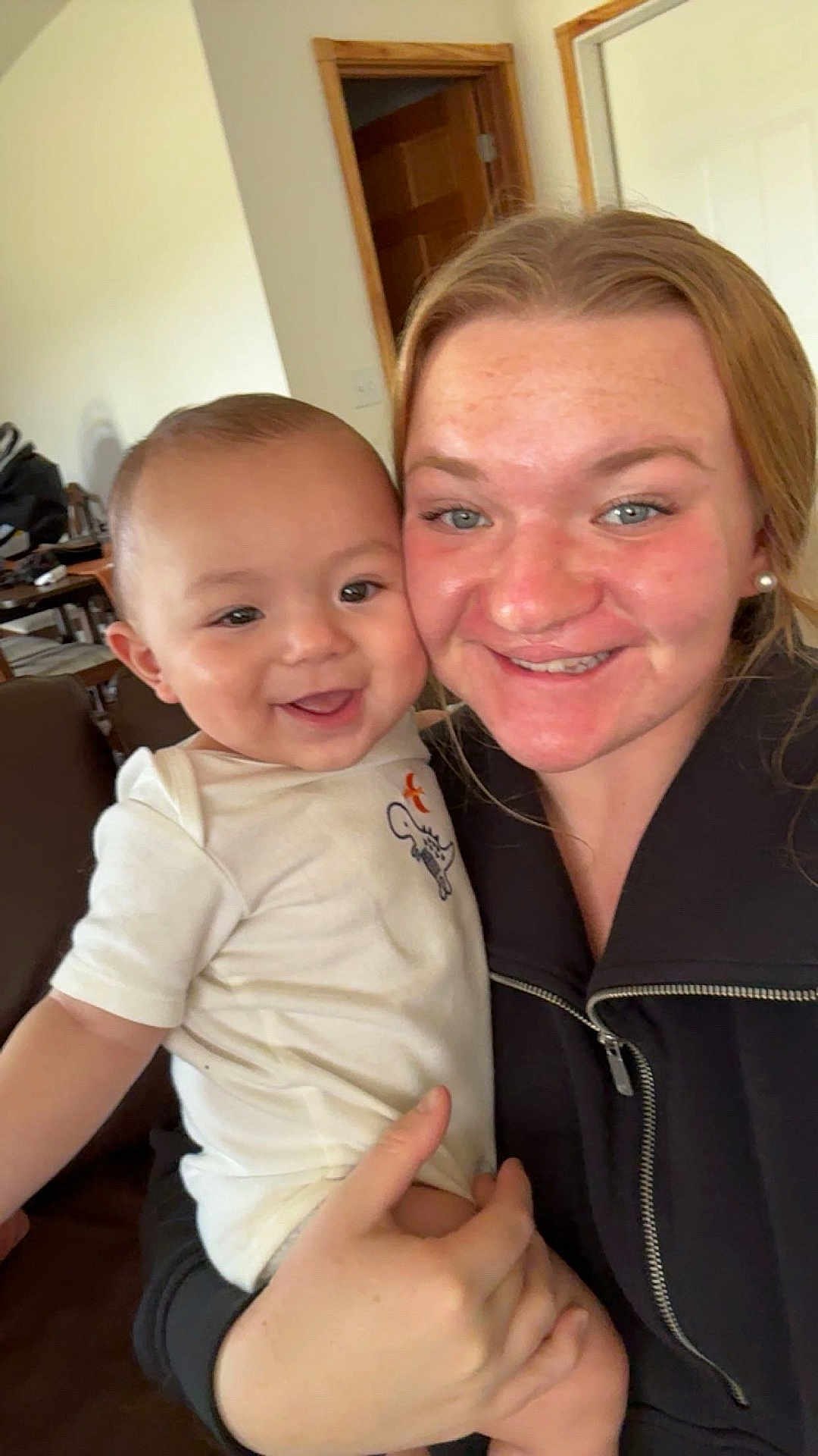 Klayten joined the competition — help win amazing prizes! baby, child, woman, smile, happy, indoor, person, clothing, holding, face, jacket, home, furniture, door, hand, skin, head, eyebrows, eyes, cheeks
