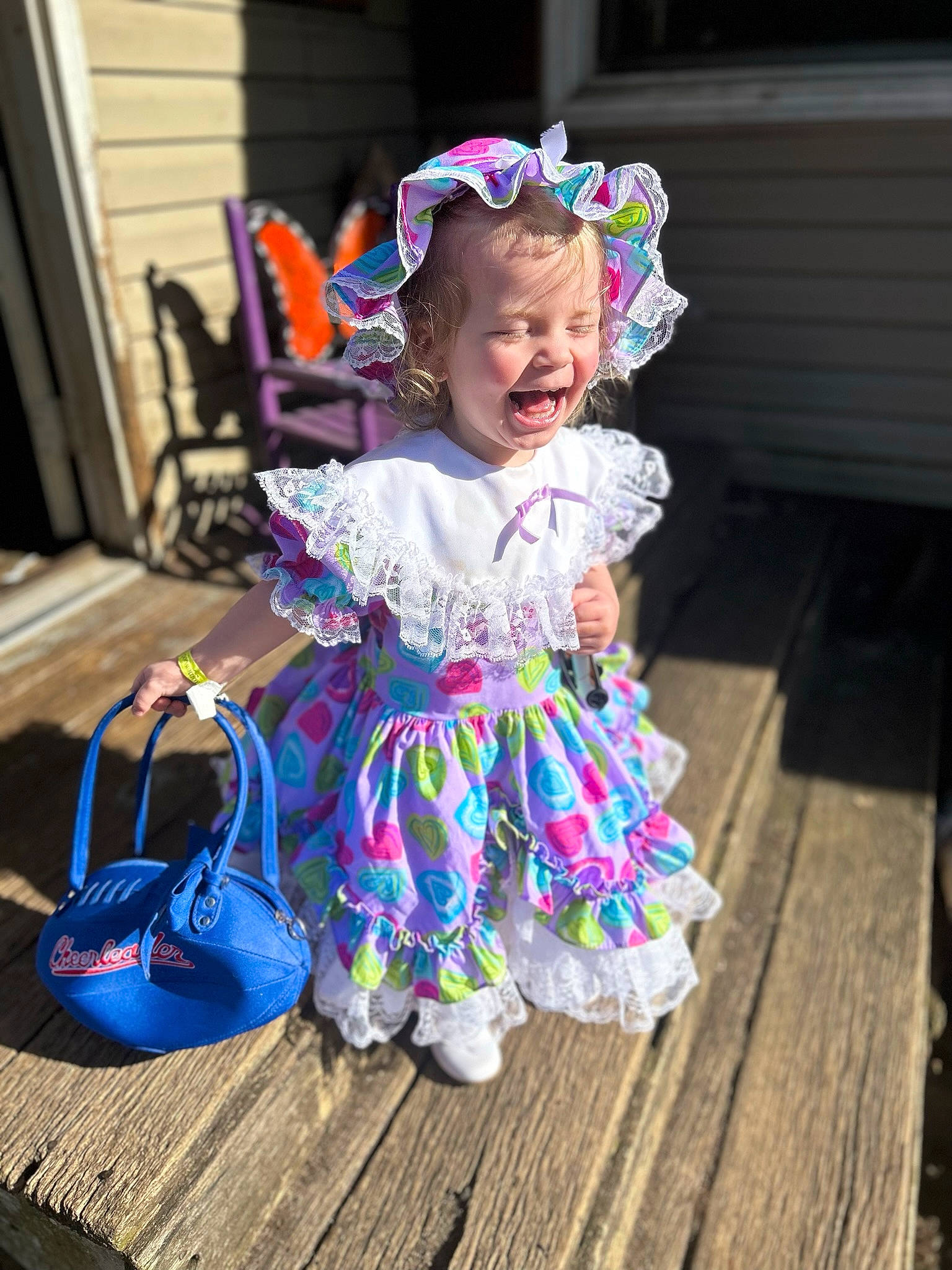Amantha Annalynn is registered to the contest to win money with this photo: baby, baby_toddler_clothing, backpack, child, event, fashion_accessory, fun, grass, happy, headpiece, luggage_and_bags, magenta, person, pink, purple, sandal, sitting, smile, toddler, vacation