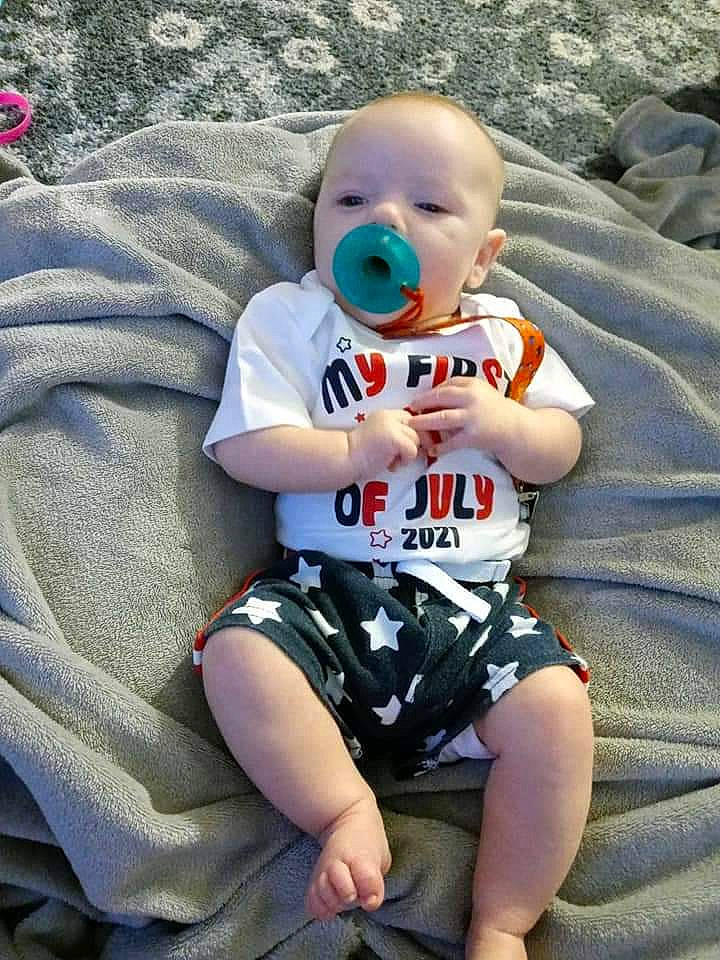 Brysyn is registered to the contest to win money with this photo: baby, baby_products, baby_toddler_clothing, carmine, child, cool, flash_photography, fun, grass, happy, knee, pattern, people_in_nature, person, play, sitting, sleeve, smile, t_shirt, thigh