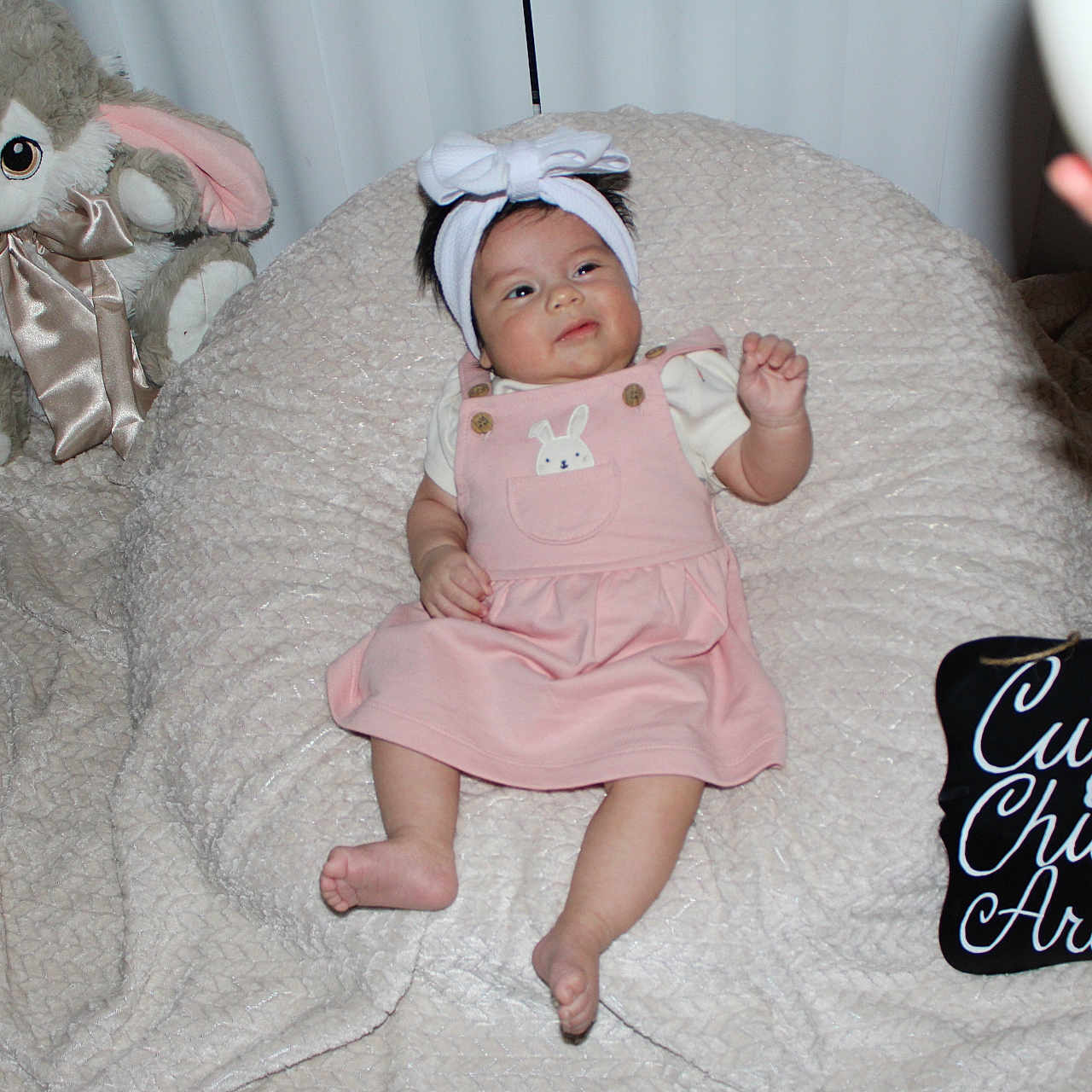 Meliana is registered to the contest to win money with this photo: baby, blanket, bodypart, bonnet, cap, clothing, couch, crib, face, finger, furniture, hand, hat, head, infantbed, newborn, person, photography, portrait, toy