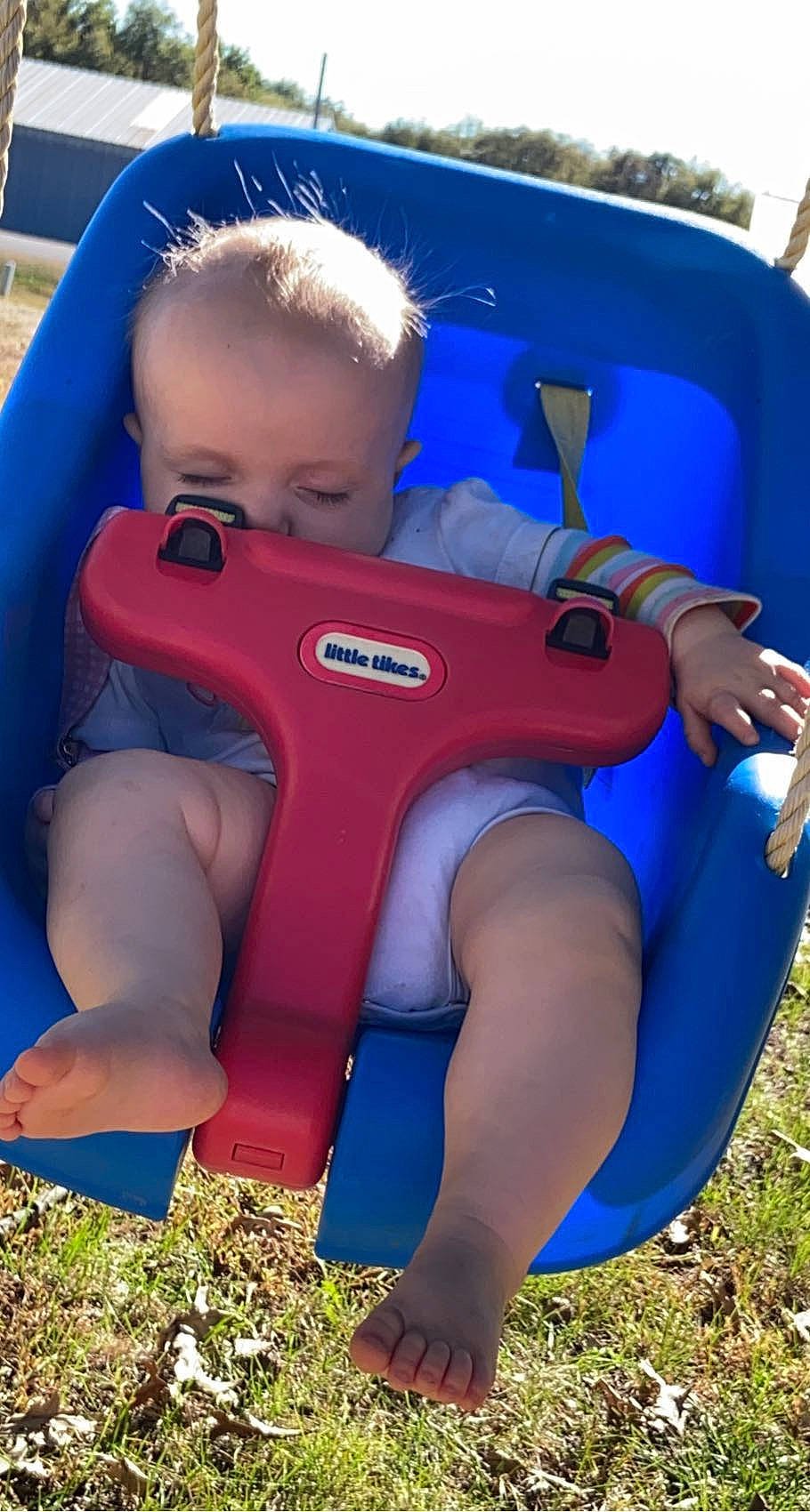 Kayla is registered to the contest to win money with this photo: baby, baby_toddler_clothing, blue, child, electric_blue, fun, grass, human_body, human_leg, inflatable, knee, leg, leisure, muscle, person, personal_protective_equipment, play, recreation, sitting, thigh