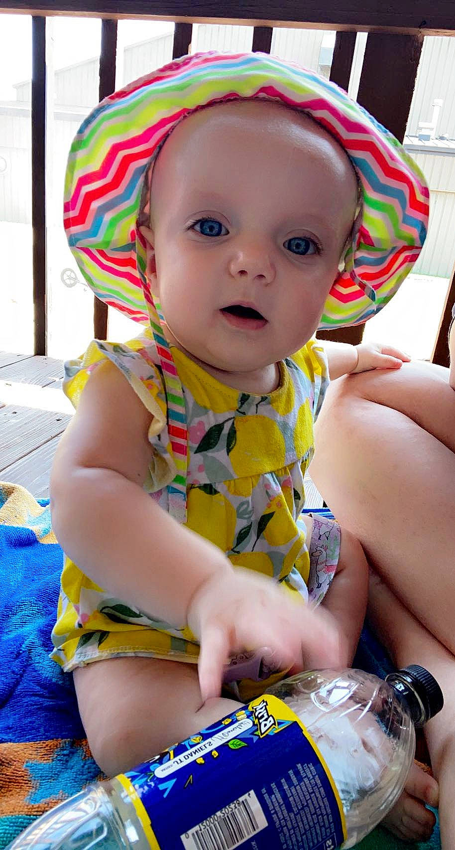 Kayla is registered to the contest to win money with this photo: baby, baby_toddler_clothing, blue, cheek, dress, eye, face, facial_expression, green, happy, human_body, iris, organ, person, photograph, pink, skin, smile, toddler, white