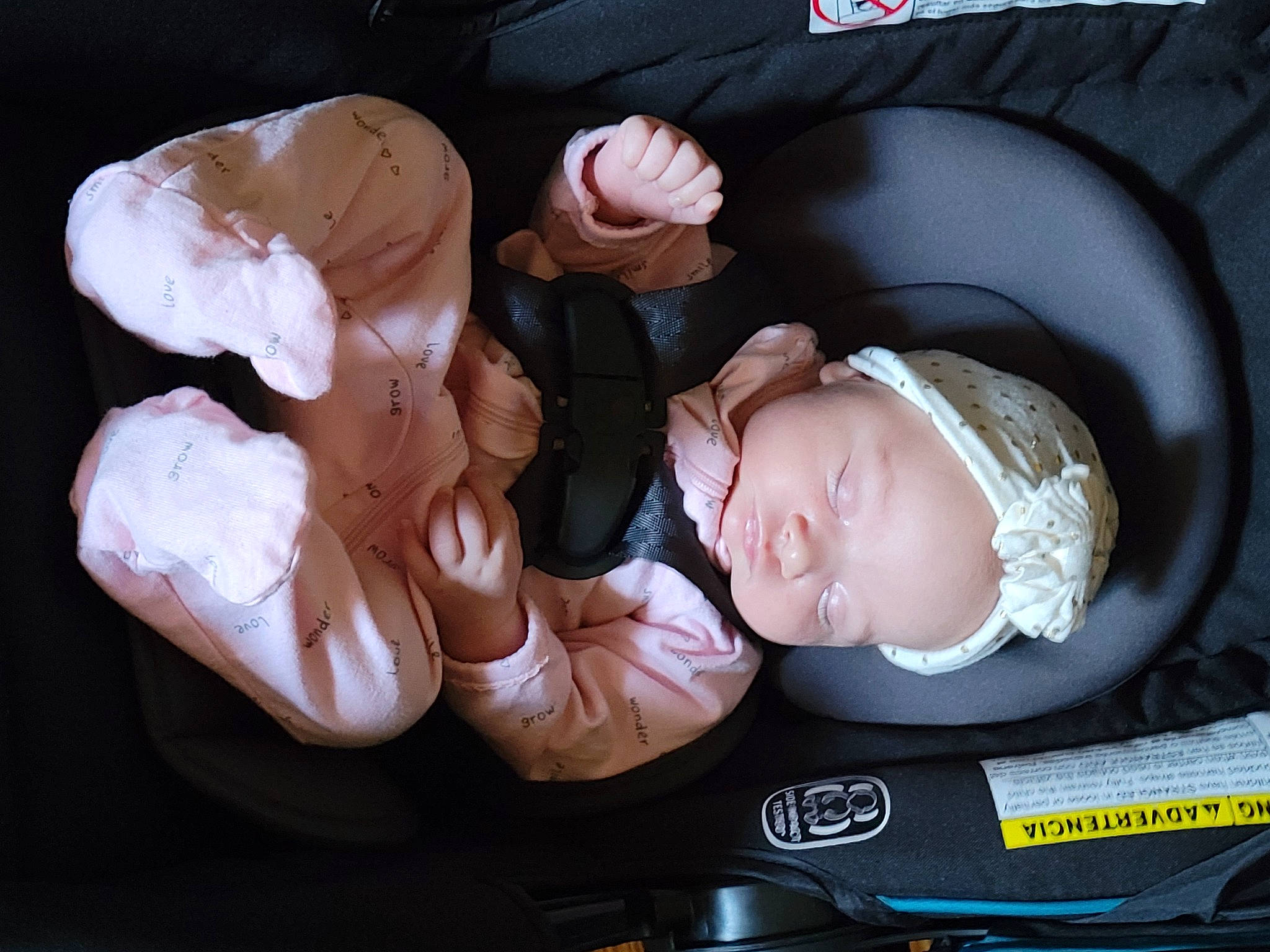 Leila is registered to the contest to win money with this photo: baby, baby_carriage, baby_in_car_seat, baby_products, baby_sleeping, baby_toddler_clothing, cheek, child, comfort, ear, fashion_accessory, fun, gesture, headgear, helmet, mouth, nap, person, sitting, sleep