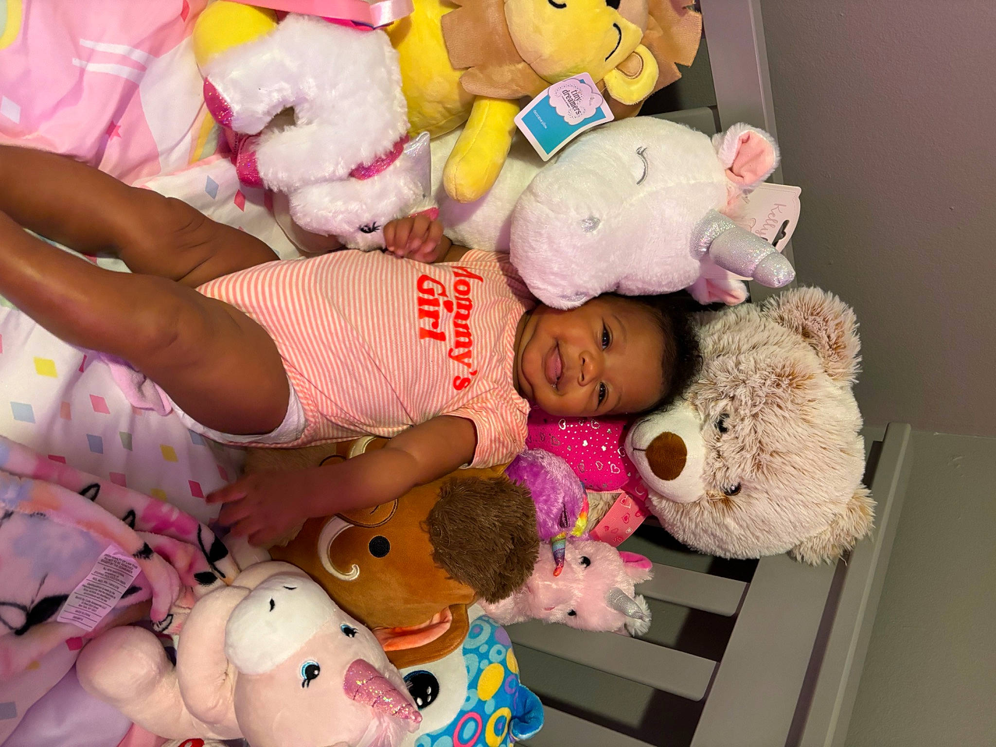 Kimora is registered to the contest to win money with this photo: baby, baby_products, baby_toddler_clothing, baby_toys, child, event, fur, happy, mammal, pattern, person, pink, plush, product, room, stuffed_toy, teddy_bear, textile, toy, white