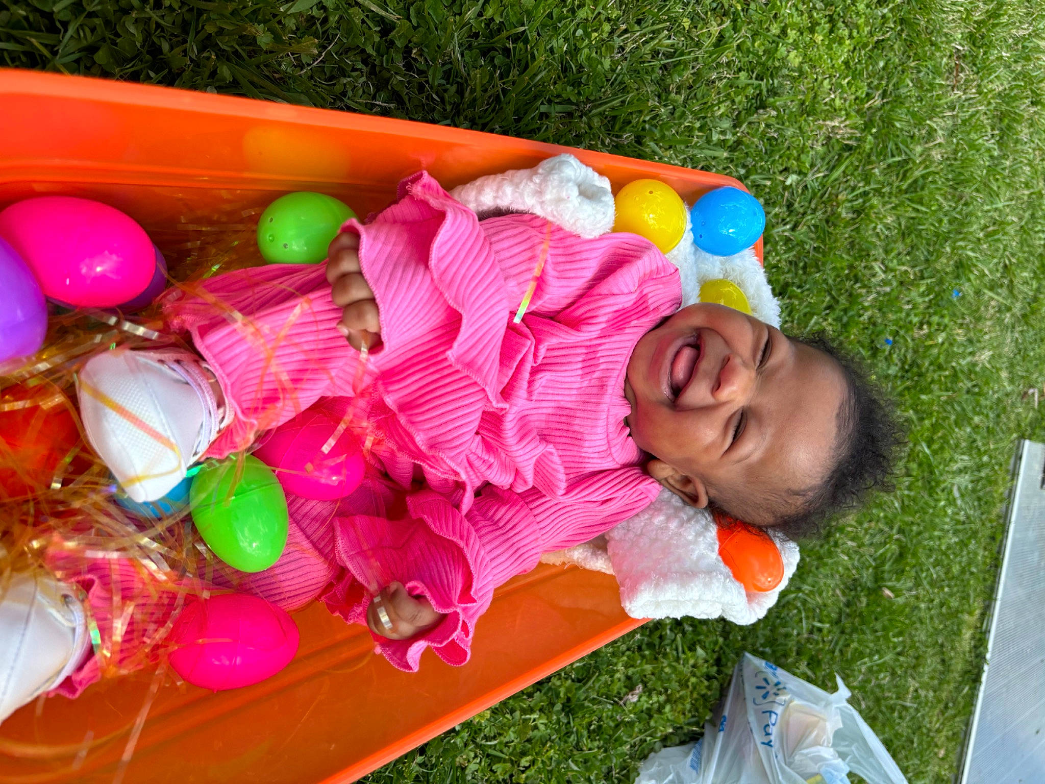 Kimora is registered to the contest to win money with this photo: baby, baby_products, baby_toddler_clothing, child, event, fun, grass, happy, leisure, magenta, outdoor_furniture, person, pink, play, public_space, recreation, smile, sweetness, toddler, toy