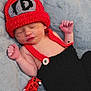 Cannon is registered to the contest to win money with this photo: adorable, baby, black_overalls, child, cozy, crocheted_clothing, cute, handmade, indoors, infant, newborn, peaceful, portrait, red_hat, relaxing, resting, sleeping, small_toy, soft_blanket, toy_fire_truck