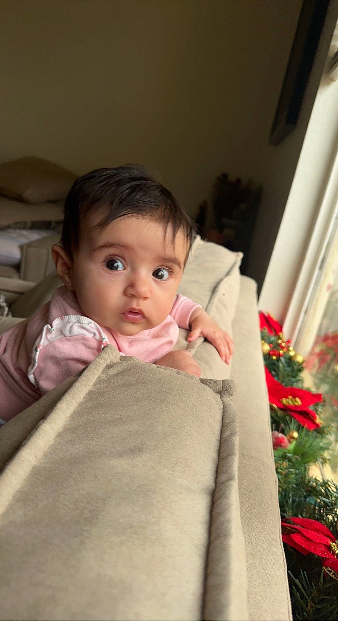 Danna is registered to the contest to win money with this photo: baby, baby_toddler_clothing, cheek, child, chin, comfort, event, facial_expression, flooring, fun, happy, iris, linens, lip, nose, person, plant, room, skin, sleeve