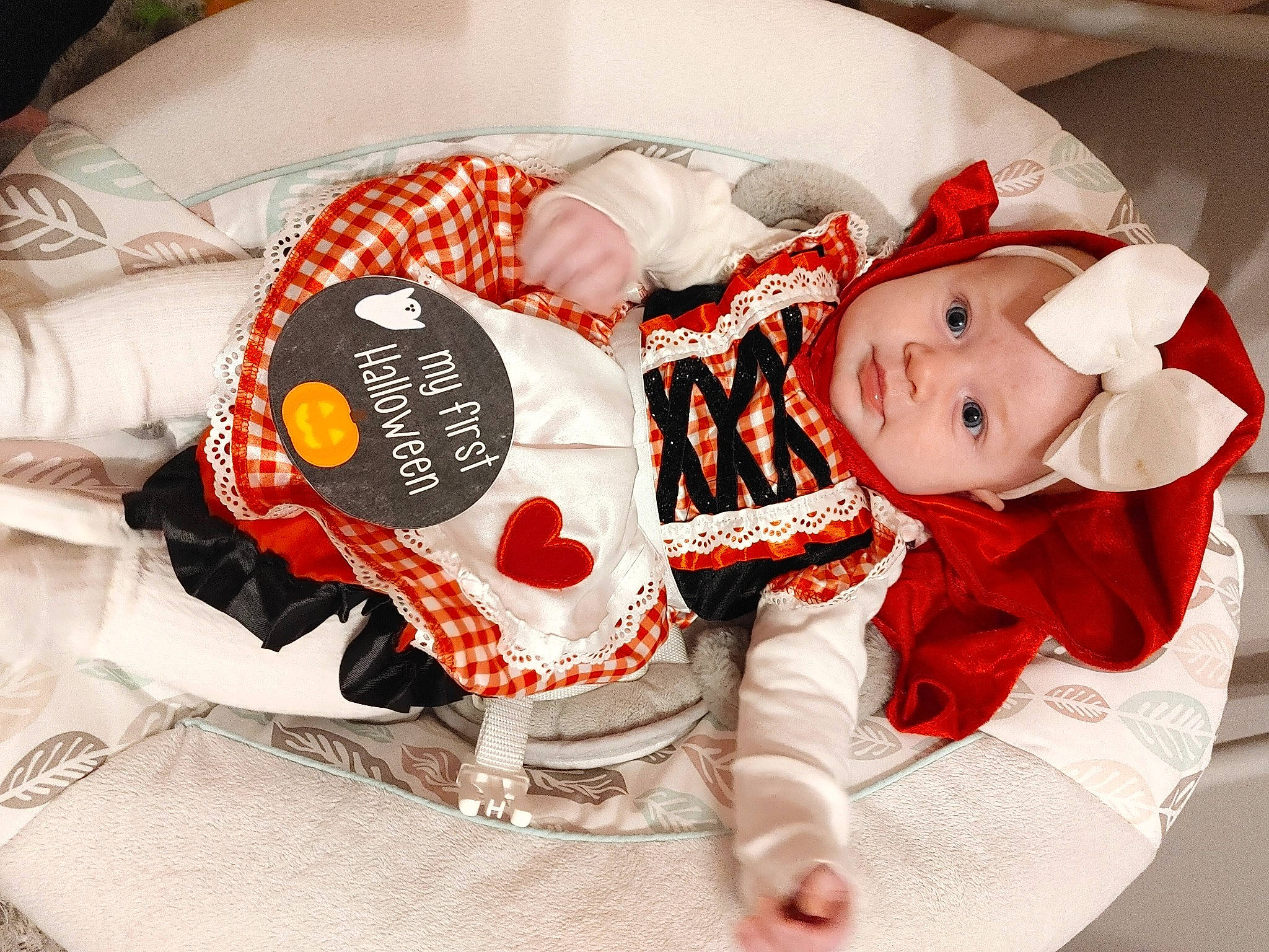 Aria is registered to the contest to win money with this photo: baby, baby_products, baby_toddler_clothing, carmine, child, christmas, comfort_food, costume, costume_hat, event, fashion_accessory, hat, headgear, headwear, linens, pattern, person, santa_claus, sleeve, sweetness