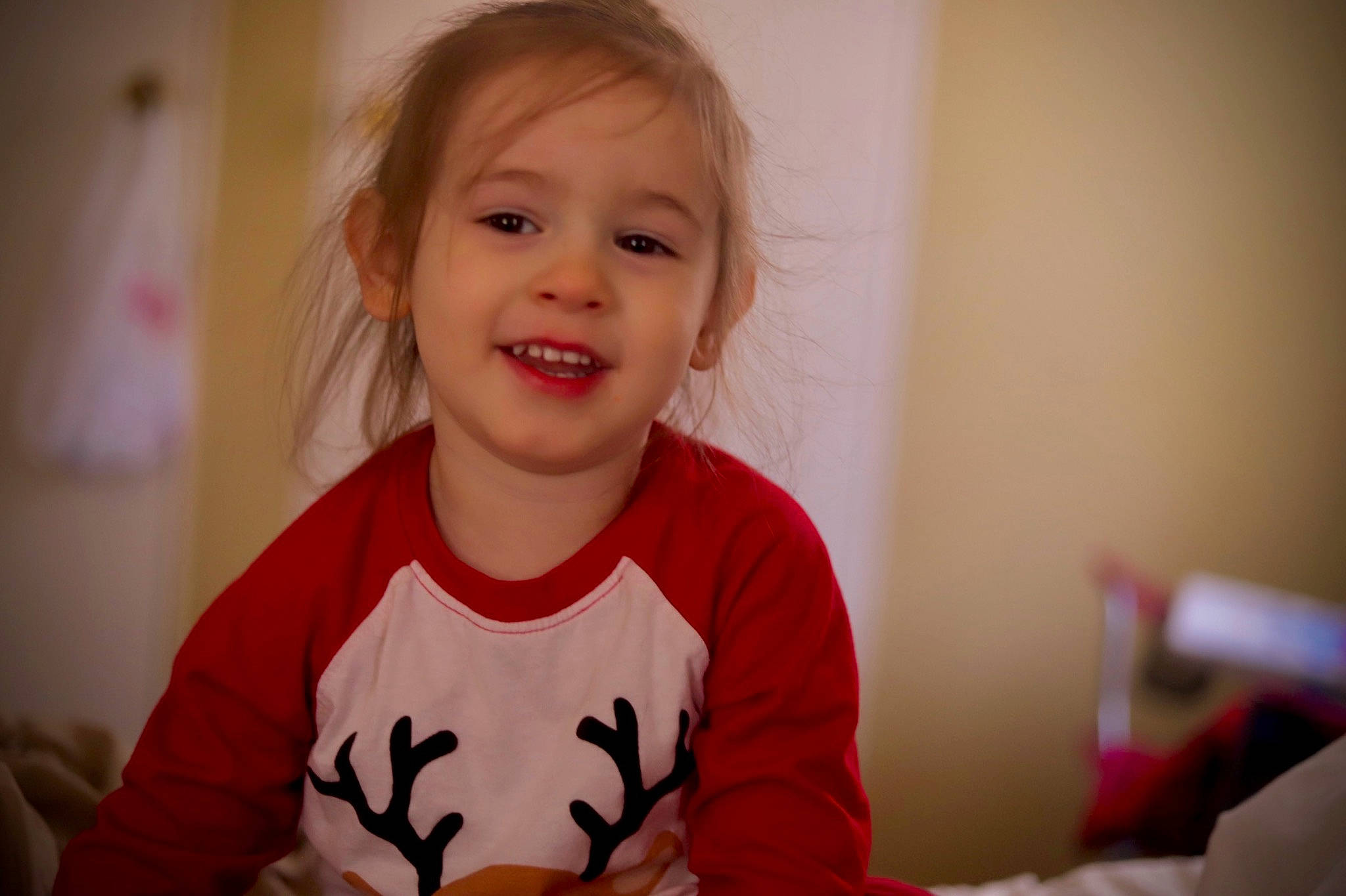 Atticus is registered to the contest to win money with this photo: arm, baby, baby_toddler_clothing, cheek, child, event, eye, eyelash, face, fun, gesture, happy, iris, joy, laugh, person, room, sitting, sleeve, smile