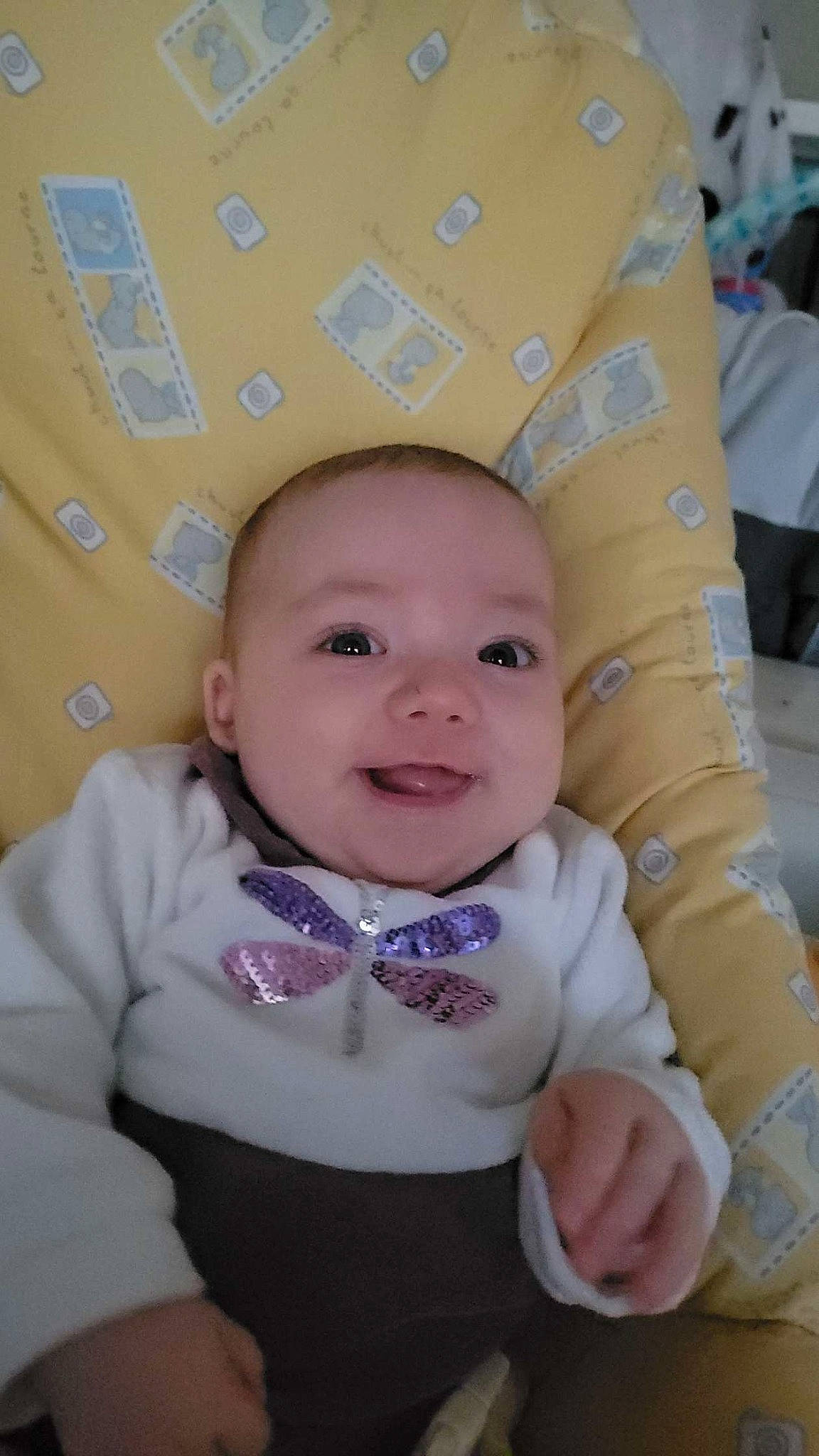 Lyna participe au concours pour gagner de l'argent avec cette photo : baby, baby_products, baby_toddler_clothing, cheek, child, eye, eyebrow, fun, happy, headgear, iris, nose, pattern, person, pink, sitting, skin, sleeve, smile, toddler