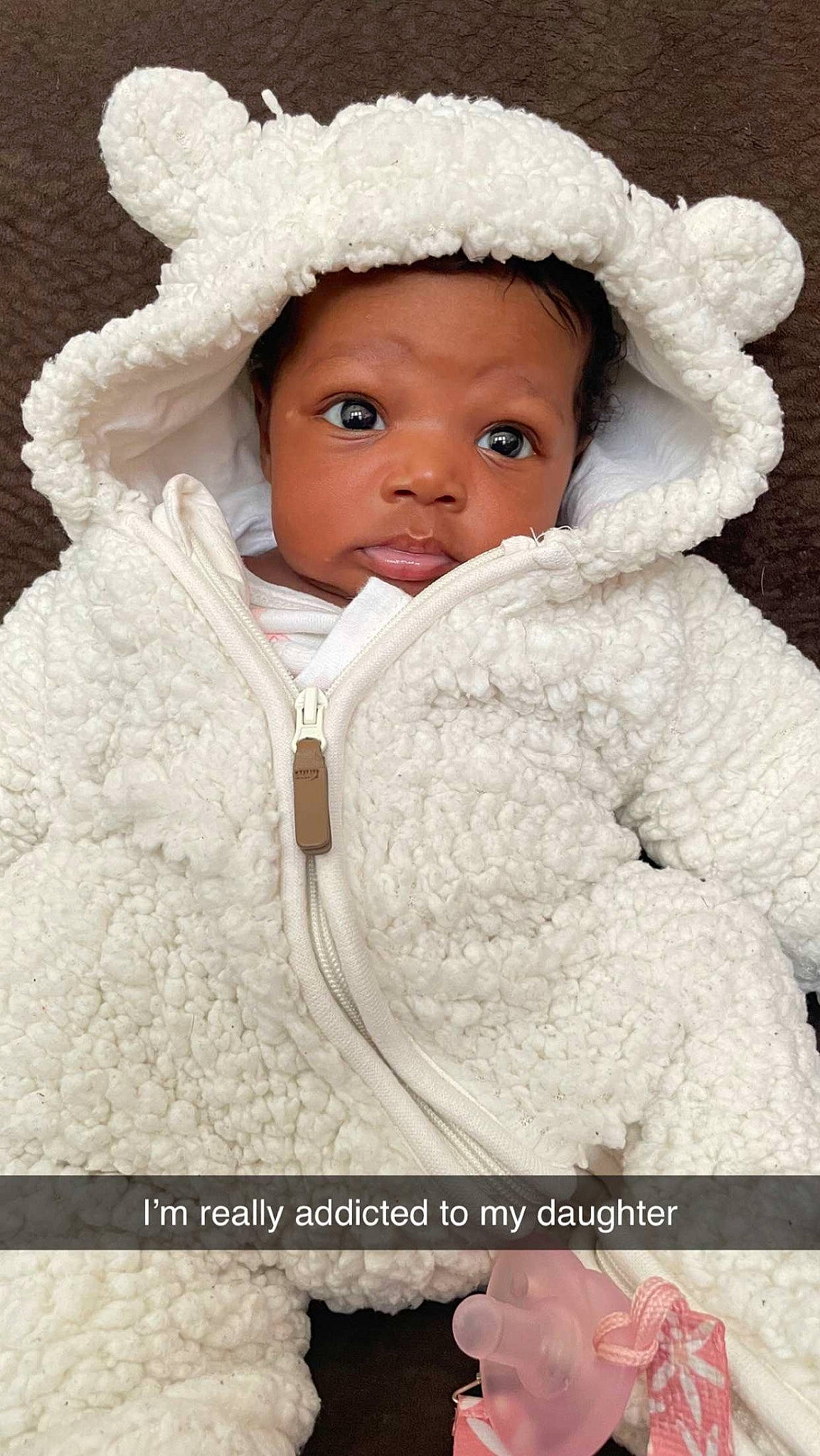 Harlem is registered to the contest to win money with this photo: baby, baby_toddler_clothing, cap, cheek, child, eyelash, freezing, fur, fur_clothing, happy, hood, jacket, nose, outerwear, person, portrait_photography, skin, sleeve, toddler, tree