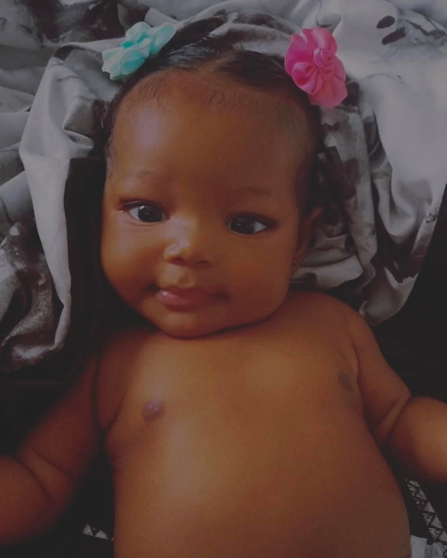 Harlem is registered to the contest to win money with this photo: baby, cheek, chest, child, chin, dress, eye, eyebrow, eyelash, hair, head, human_body, iris, lip, mouth, nose, person, pink, skin, smile