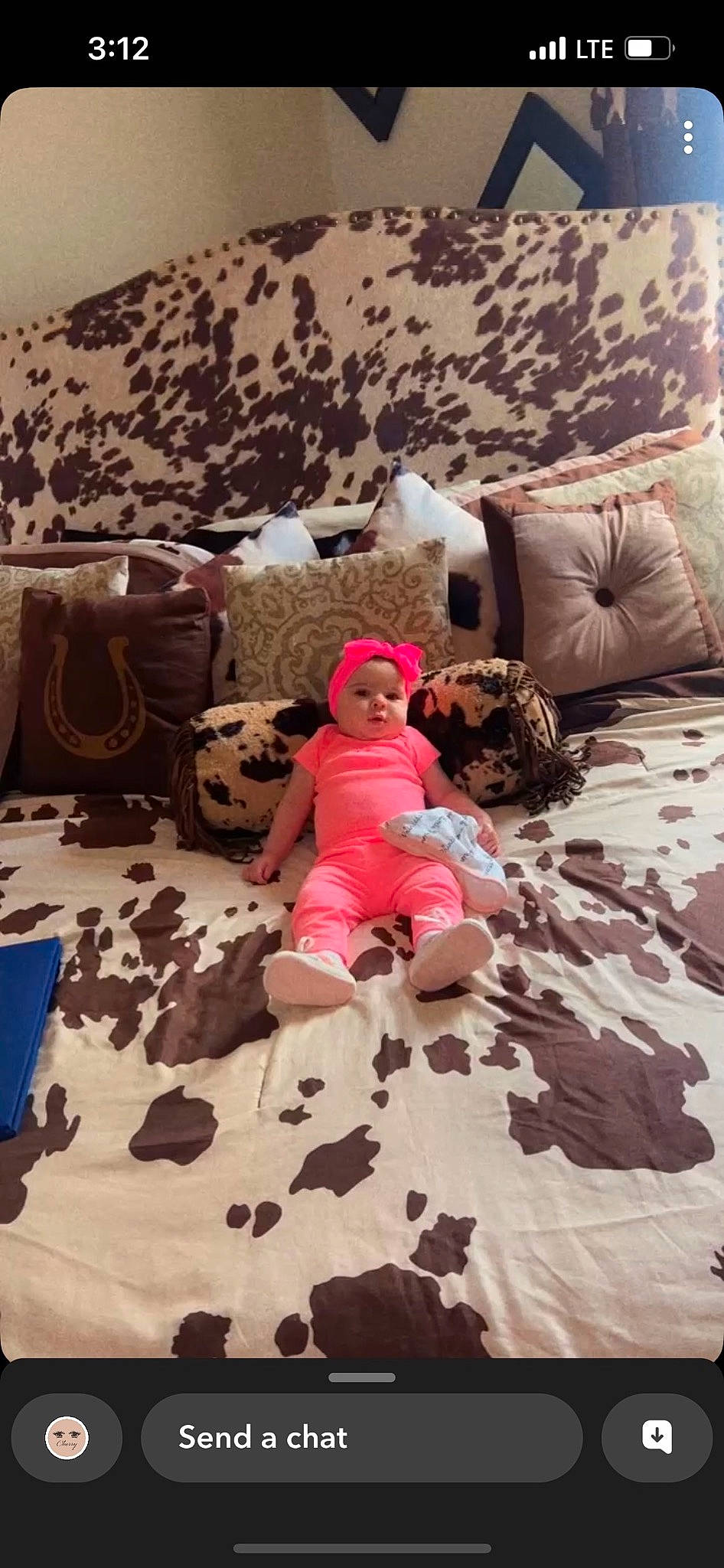 Oakleigh is registered to the contest to win money with this photo: baby, bed_sheet, bedding, bedroom, child, comfort, floor, flooring, fun, headwear, leisure, linens, mammal, person, pink, sitting, t_shirt, textile, thigh, toddler