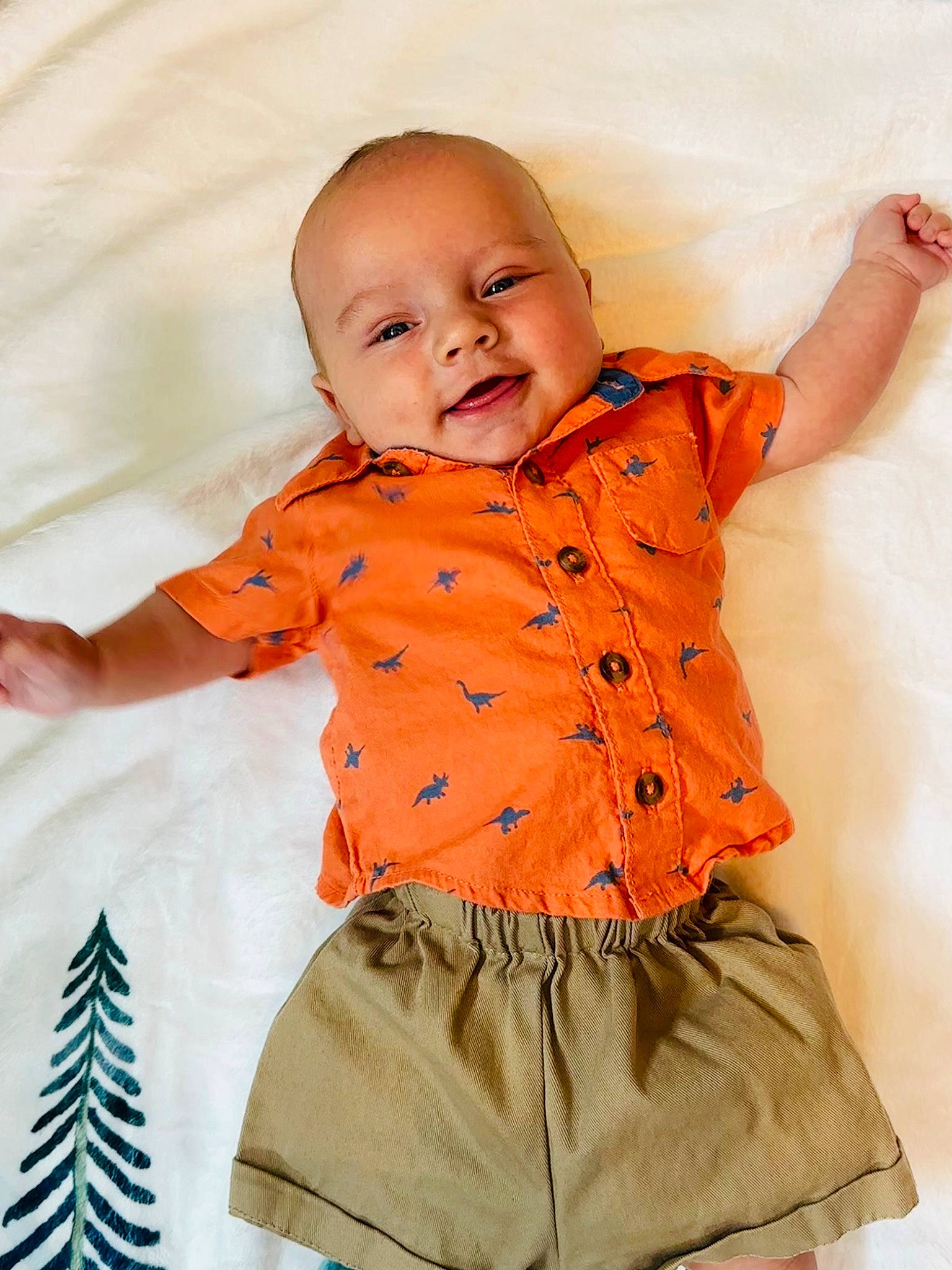 Lennox is registered to the contest to win money with this photo: baby, baby_toddler_clothing, child, collar, comfort, dress_shirt, face, happy, orange, people, person, pink, product, skin, sleeve, smile, standing, t_shirt, textile, toddler