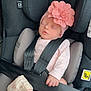 baby, blanket, car_seat, child, clothing, comfort, cute, flower_headband, hand, headwear, indoors, infant, pink, rest, safety_harness, seat, sleeping, soft, strap, toddler