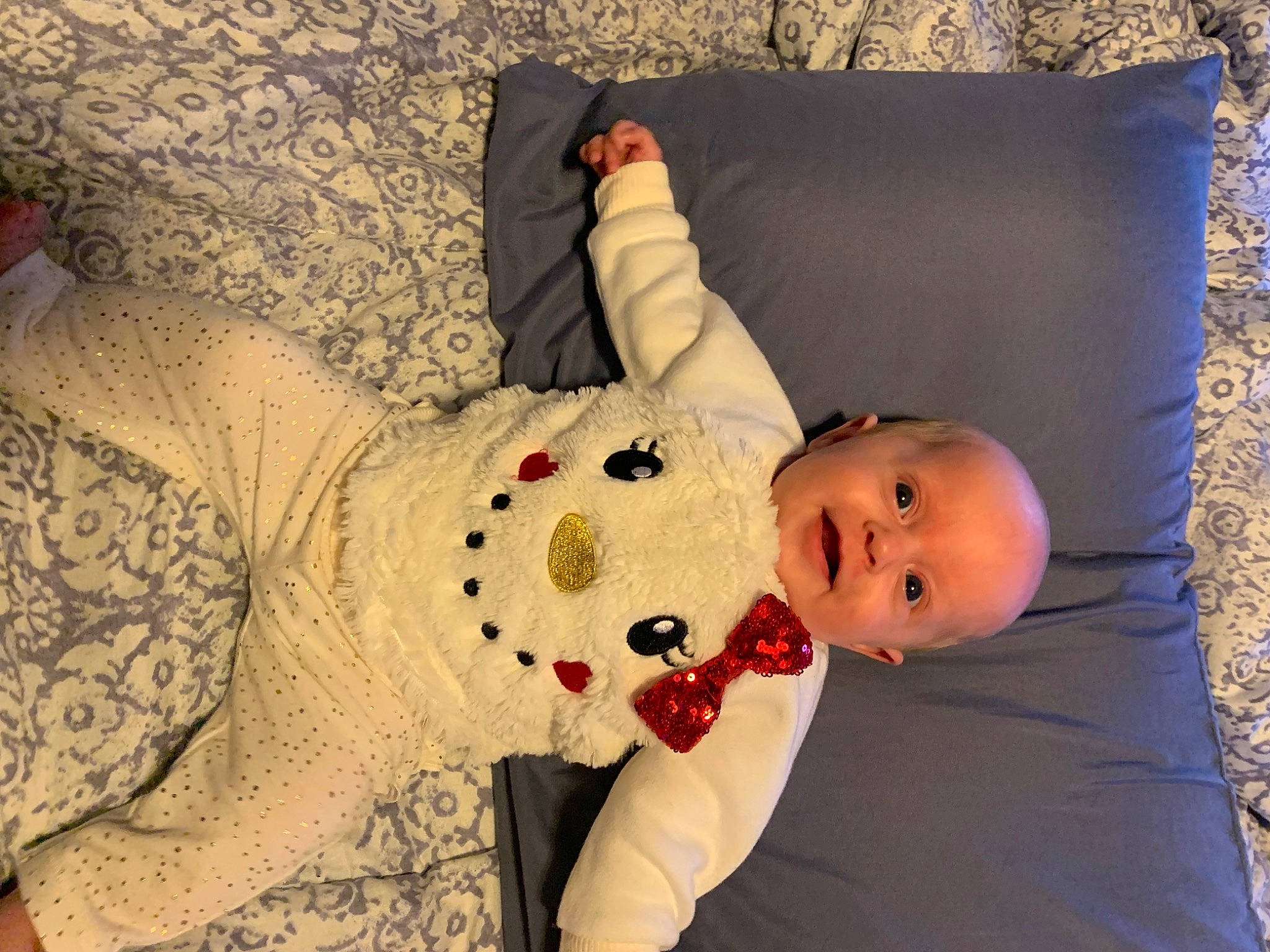 Gemma joined the competition — help win amazing prizes! abdomen, baby, baby_toddler_clothing, child, comfort, couch, dress, eye, flooring, human_body, leg, linens, pattern, person, room, sitting, sleeve, textile, toddler, tree