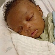 Jacoby is registered to the contest to win money with this photo: baby, sleeping, blanket, curly_hair, close_up, peaceful, infant, soft, cozy, bed, resting, indoors, child, face, portrait, cute, young, toddler, skin, comfort