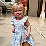toddler, child, girl, dress, blue_dress, basket, shopping_mall, indoor, smile, happy, blonde_hair, cute, floor_tiles, person, fashion, summer, footwear, innocence, portrait, young_child