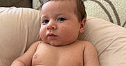 Cosmo is registered to the contest to win money with this photo: baby, blanket, child, chubby, comfortable, couch, cushion, cute, expression, hair, home, indoors, infant, person, portrait, relaxed, seated, skin, soft, young