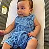 Cosmo joined the competition — help win amazing prizes! baby, infant, child, romper, blue_clothing, patterned_clothing, baby_seat, texture, warning_label, curious_expression, skin, hair, arm, leg, indoors, comfort, sitting, portrait, cute, young_child
