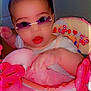 Addyson is registered to the contest to win money with this photo: baby, sunglasses, pink, toy, child, indoor, seat, face, hand, clothing, cute, person, infant, colorful, playtime, smile, expression, closeup, accessory, nursery