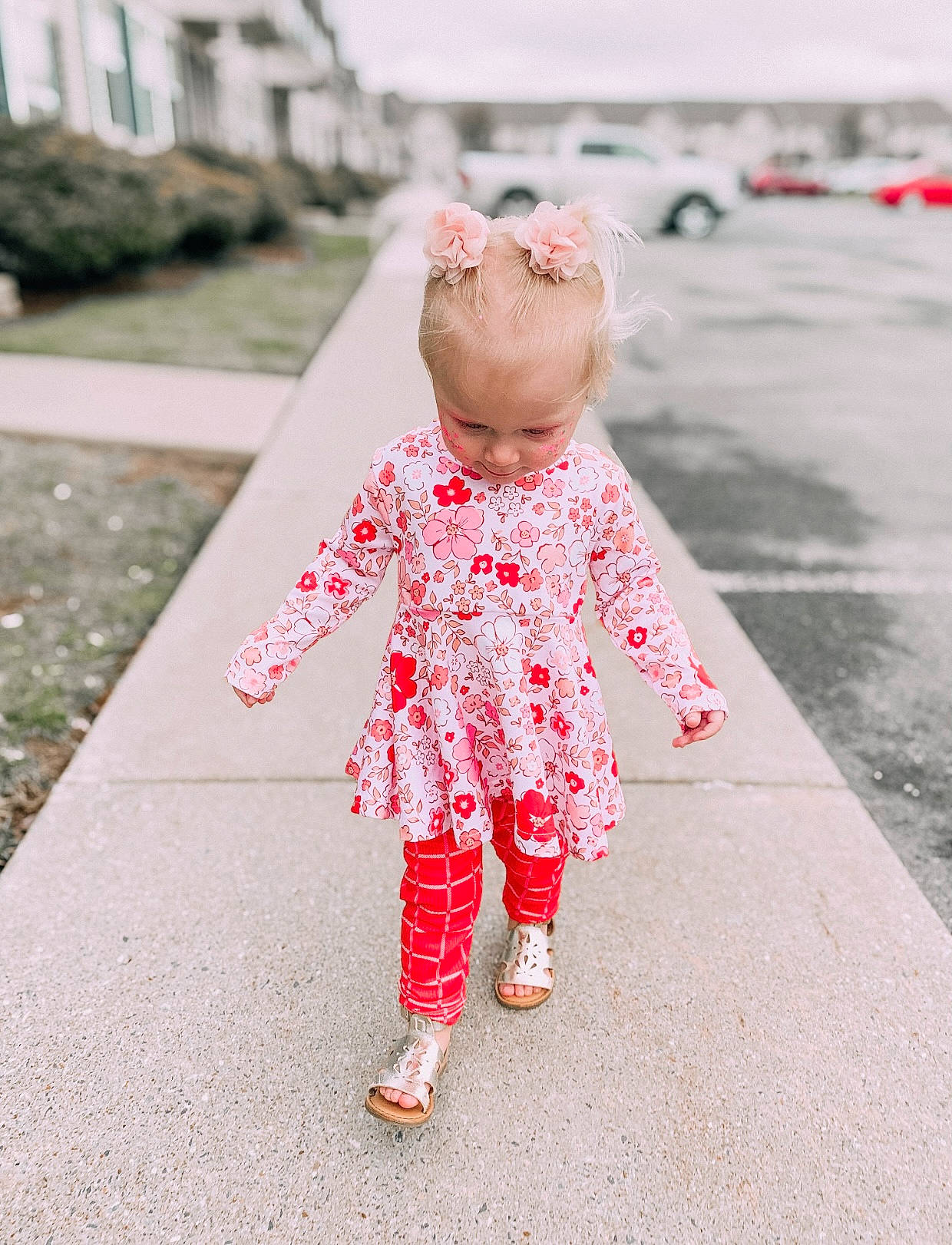 Aura joined the competition — help win amazing prizes! arm, asphalt, baby, baby_toddler_clothing, dress, flooring, gesture, grass, hand, happy, human_body, leisure, people_in_nature, person, pink, plant, public_space, road_surface, skin, sleeve