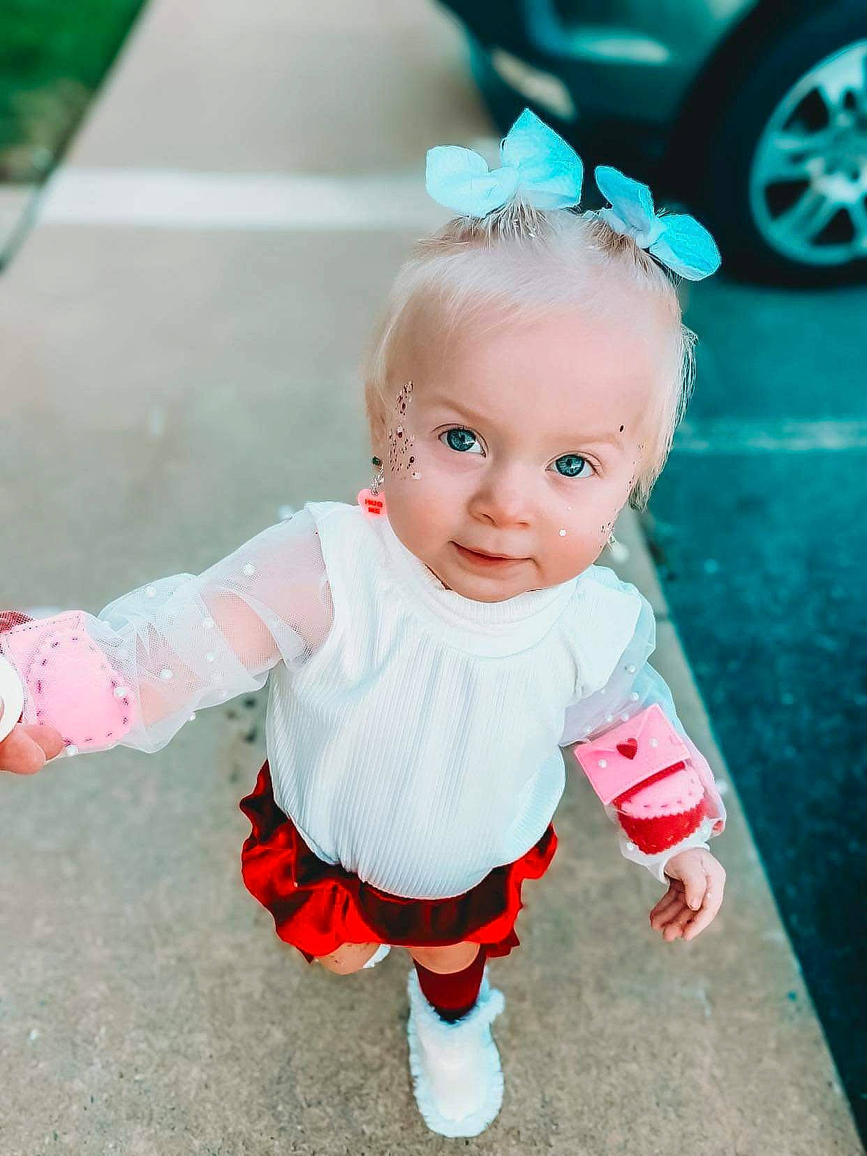 Aura joined the competition — help win amazing prizes! baby, baby_toddler_clothing, child, costume, fashion_accessory, fictional_character, fun, green, happy, pattern, person, pink, play, sitting, skin, sleeve, sock, tire, toddler, wheel