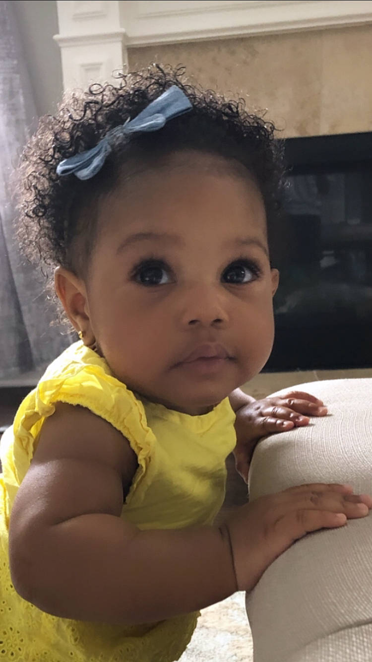 Emeri joined the competition — help win amazing prizes! baby, cheek, child, face, hair_accessory, head, headband, lip, nose, person, skin, smile, toddler, yellow