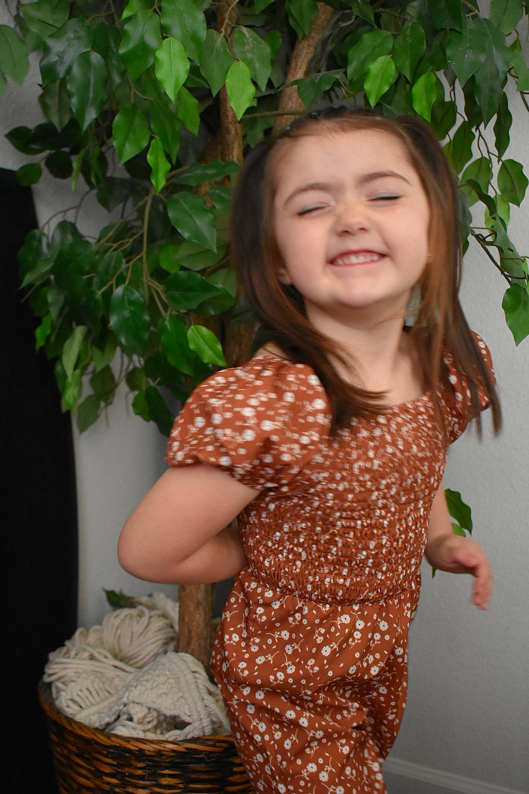 Allie is registered to the contest to win money with this photo: basket, day_dress, face, flash_photography, grass, happy, head, joy, laundry_basket, lip, long_hair, neck, people_in_nature, person, picnic_basket, sleeve, smile, storage_basket, toddler, trunk