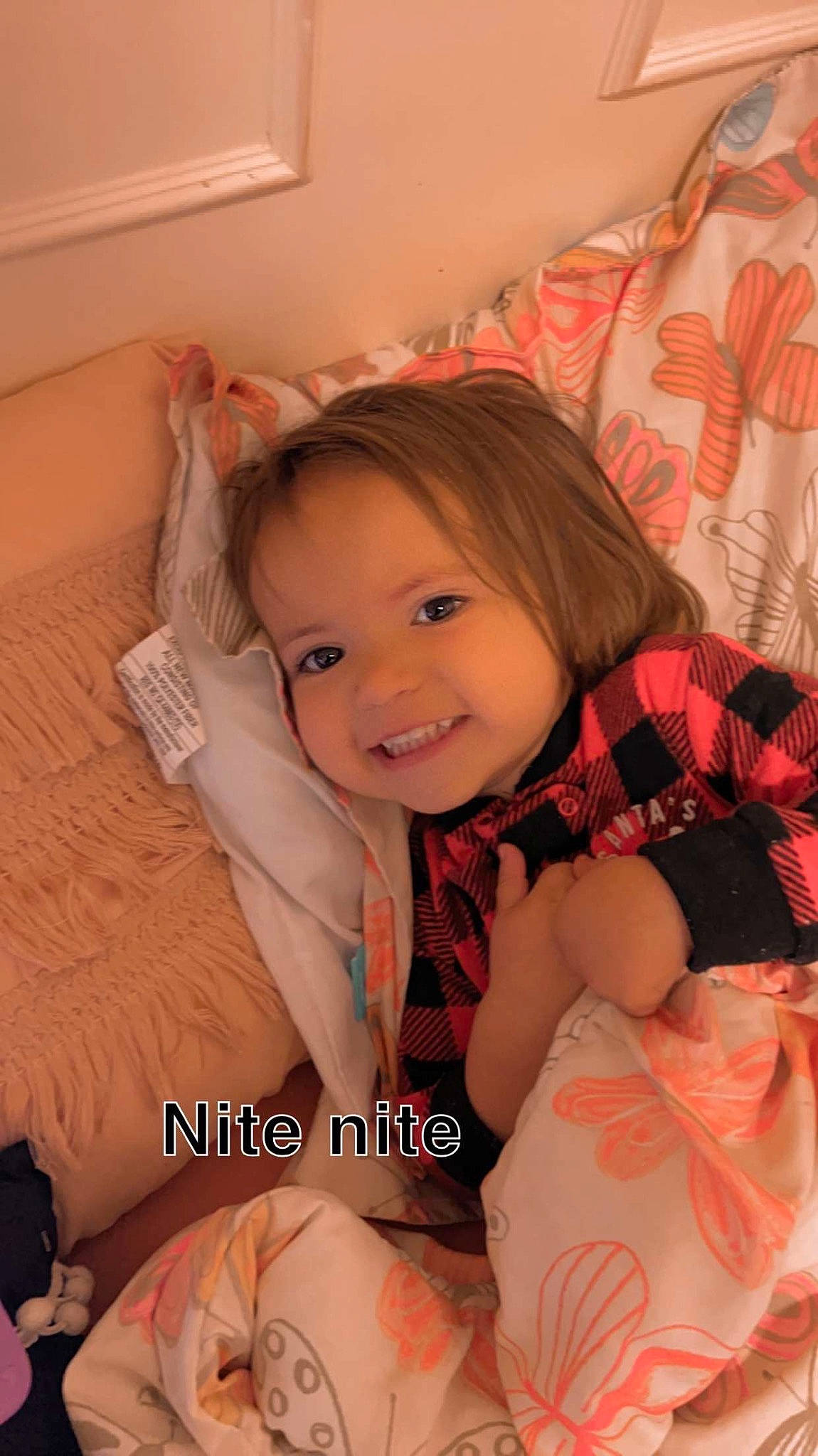 Chloe is registered to the contest to win money with this photo: baby_toddler_clothing, cheek, child, comfort, eye, facial_expression, finger, fun, happy, human, joy, leg, linens, mouth, people, person, pink, skin, smile, thigh