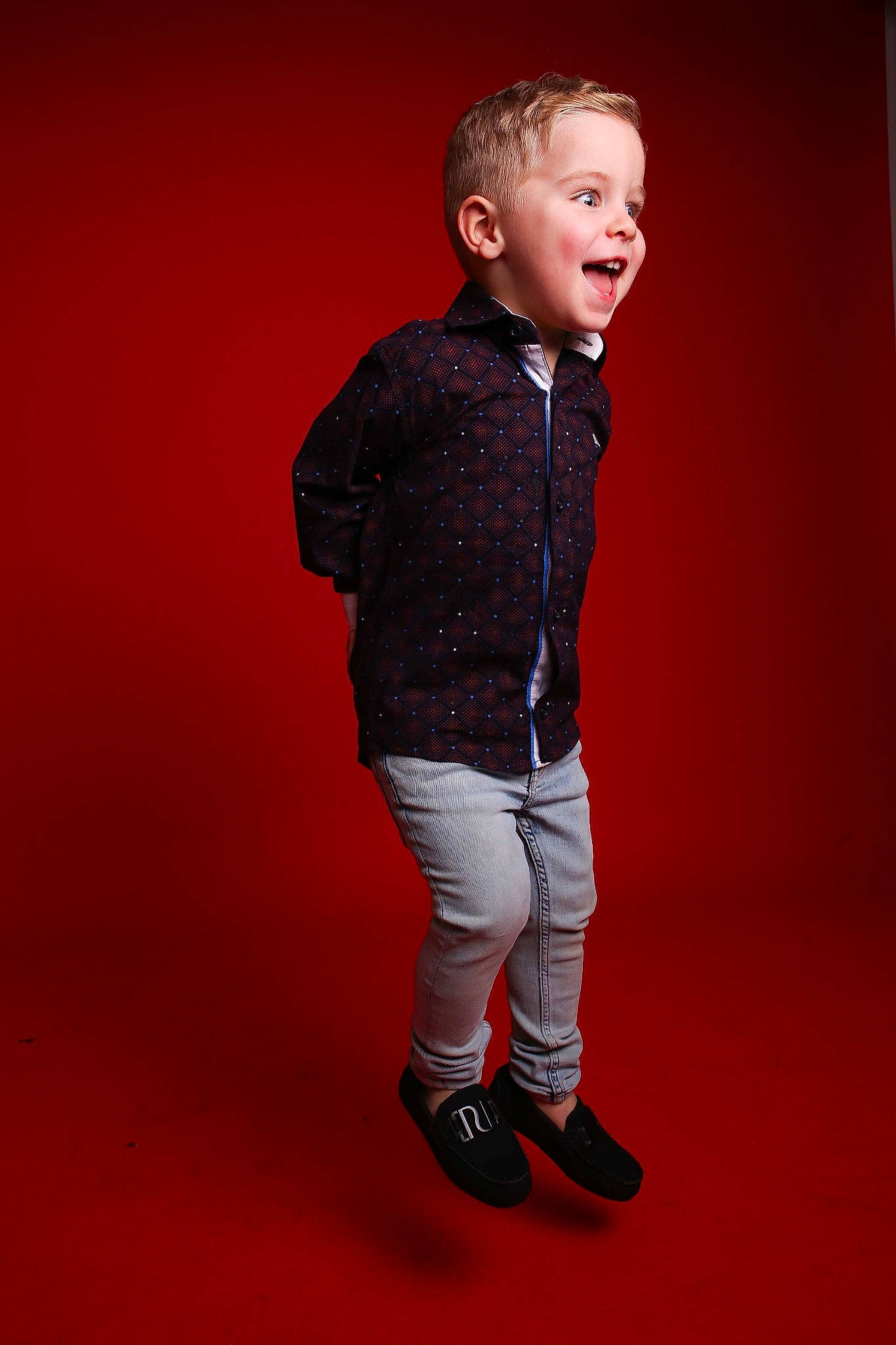 Jenson is registered to the contest to win money with this photo: child, child_model, denim, fashion, footwear, human, jacket, joint, outerwear, person, photo_shoot, photography, red, shoe, sleeve, standing