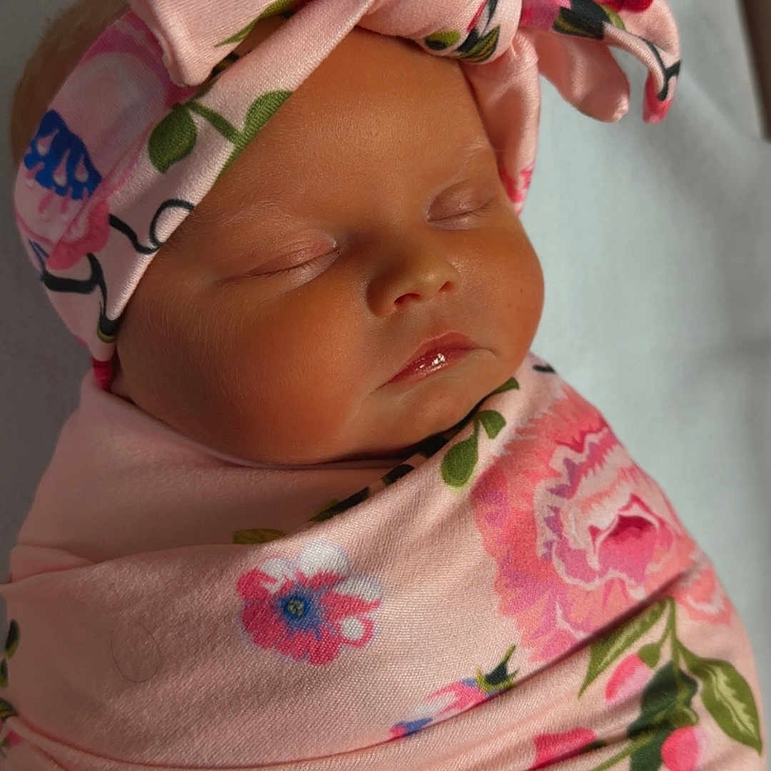 Vaeda joined the competition — help win amazing prizes! adorable, baby, blanket, bow, child, closeup, cute, face, floral, headband, indoors, infant, newborn, peaceful, pink, portrait, skin, sleeping, soft, wrapped