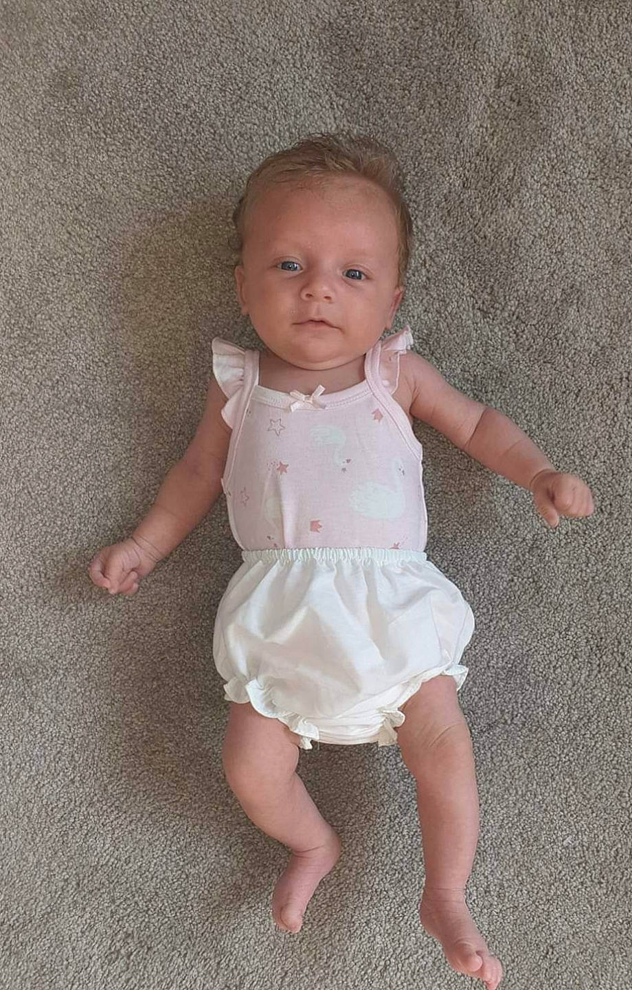 Connie joined the competition — help win amazing prizes! baby, baby_toddler_clothing, barefoot, child, dress, leg, person, pink, sitting, skin, smile, standing, toddler