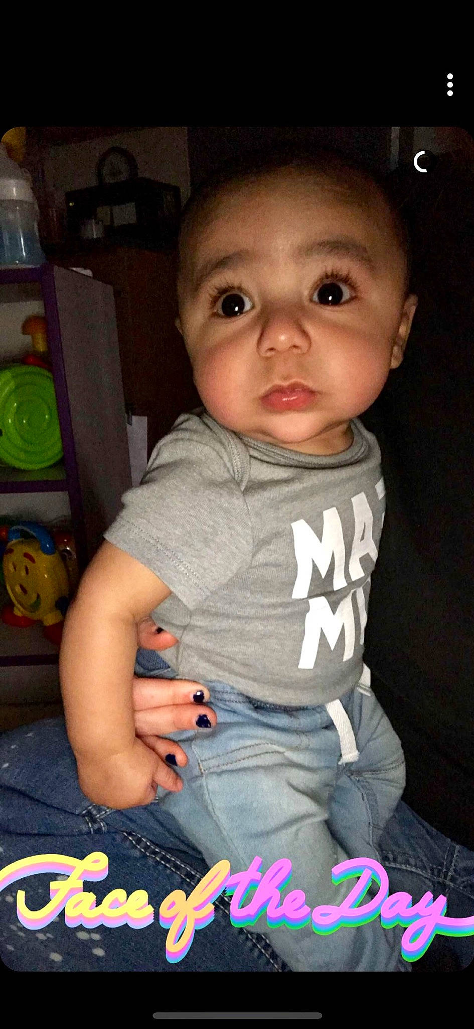 Saint is registered to the contest to win money with this photo: baby, black_hair, cheek, child, chin, cool, eye, face, forehead, fun, iris, lip, nose, person, play, sitting, skin, smile, toddler