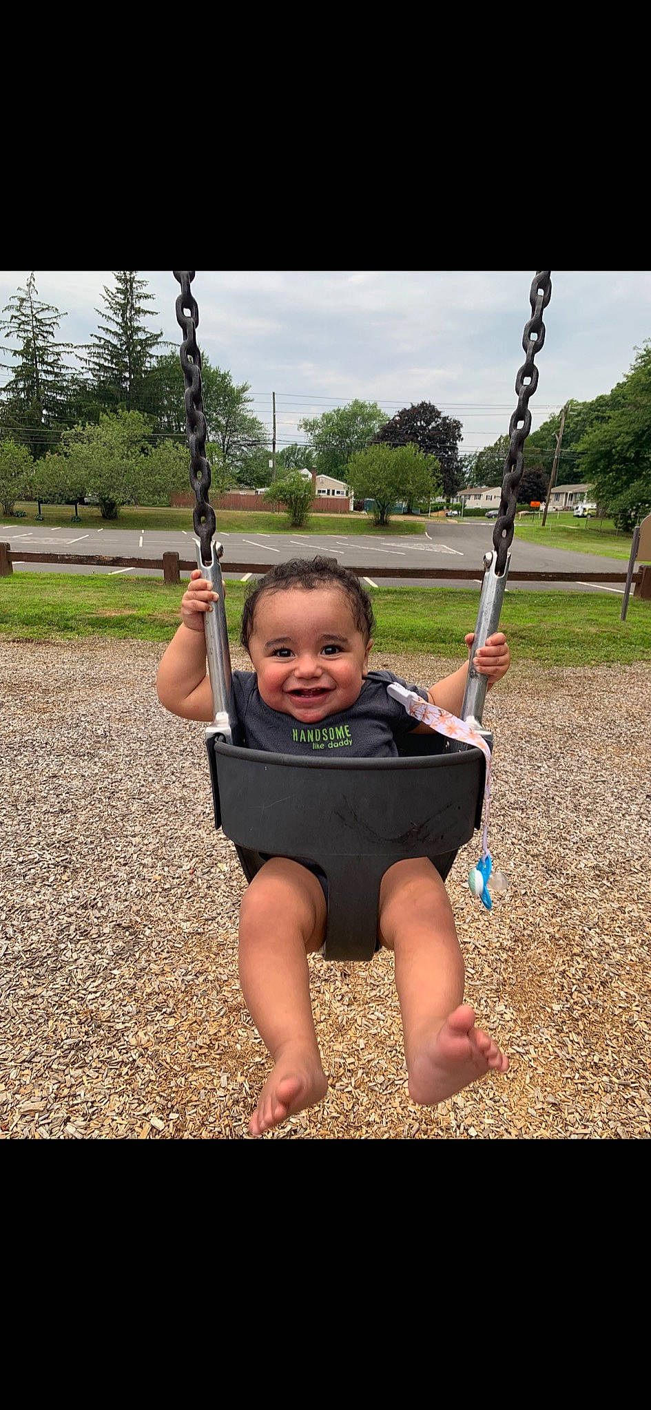 Saint joined the competition — help win amazing prizes! child, fun, joy, outdoor_play_equipment, person, play, playground, public_space, recreation, smile, swing, toddler, tree