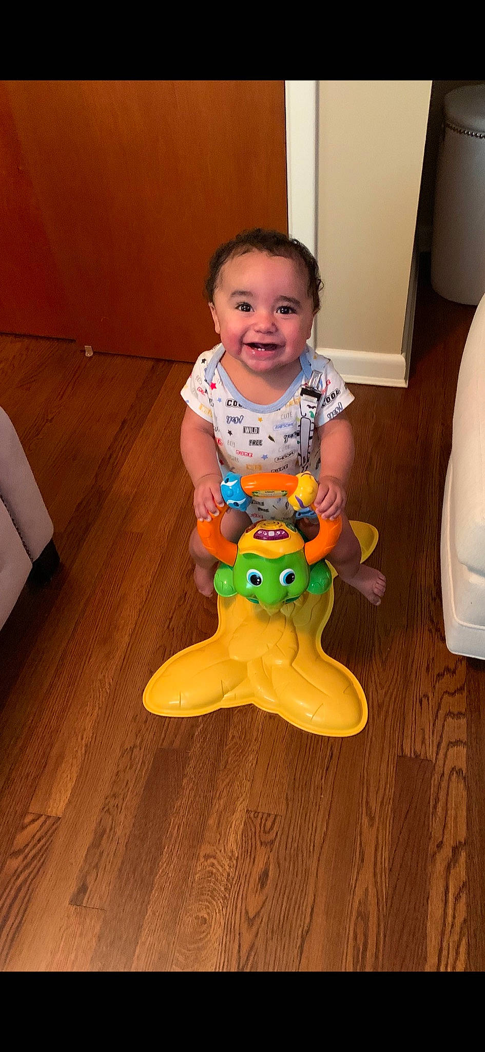 Saint joined the competition — help win amazing prizes! baby_toys, child, floor, flooring, hardwood, joy, person, play, toddler, toy, wood_flooring