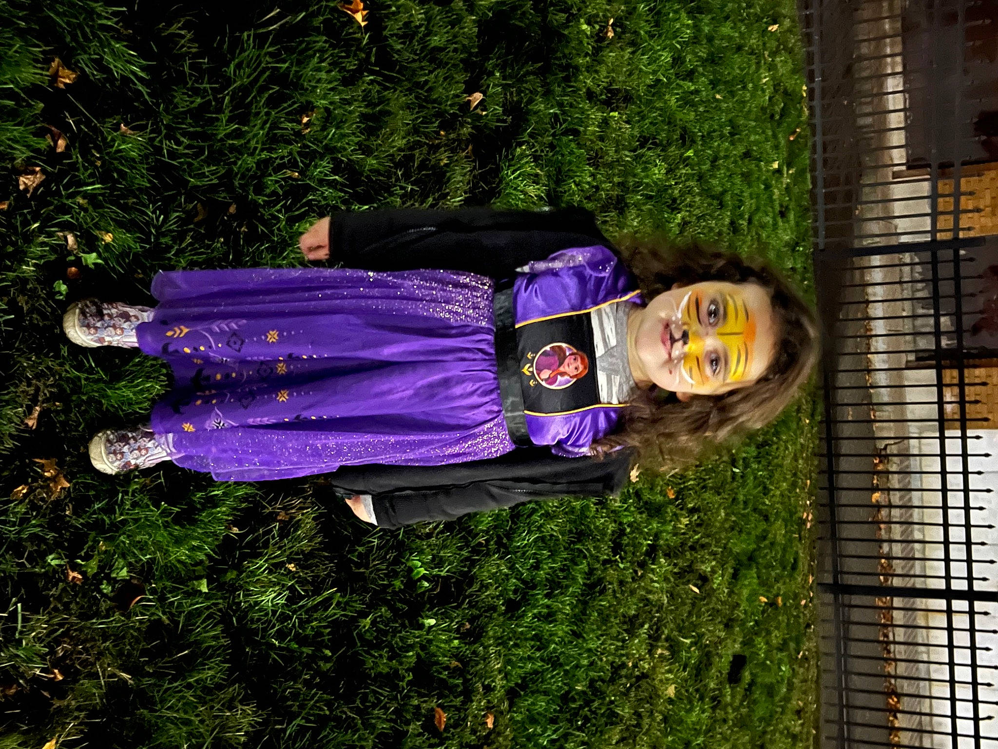 Sophia joined the competition — help win amazing prizes! brick, brickwork, building, costume, electric_blue, fun, grass, happy, hat, people_in_nature, person, plant, purple, shrub, smile, tree, window, wood