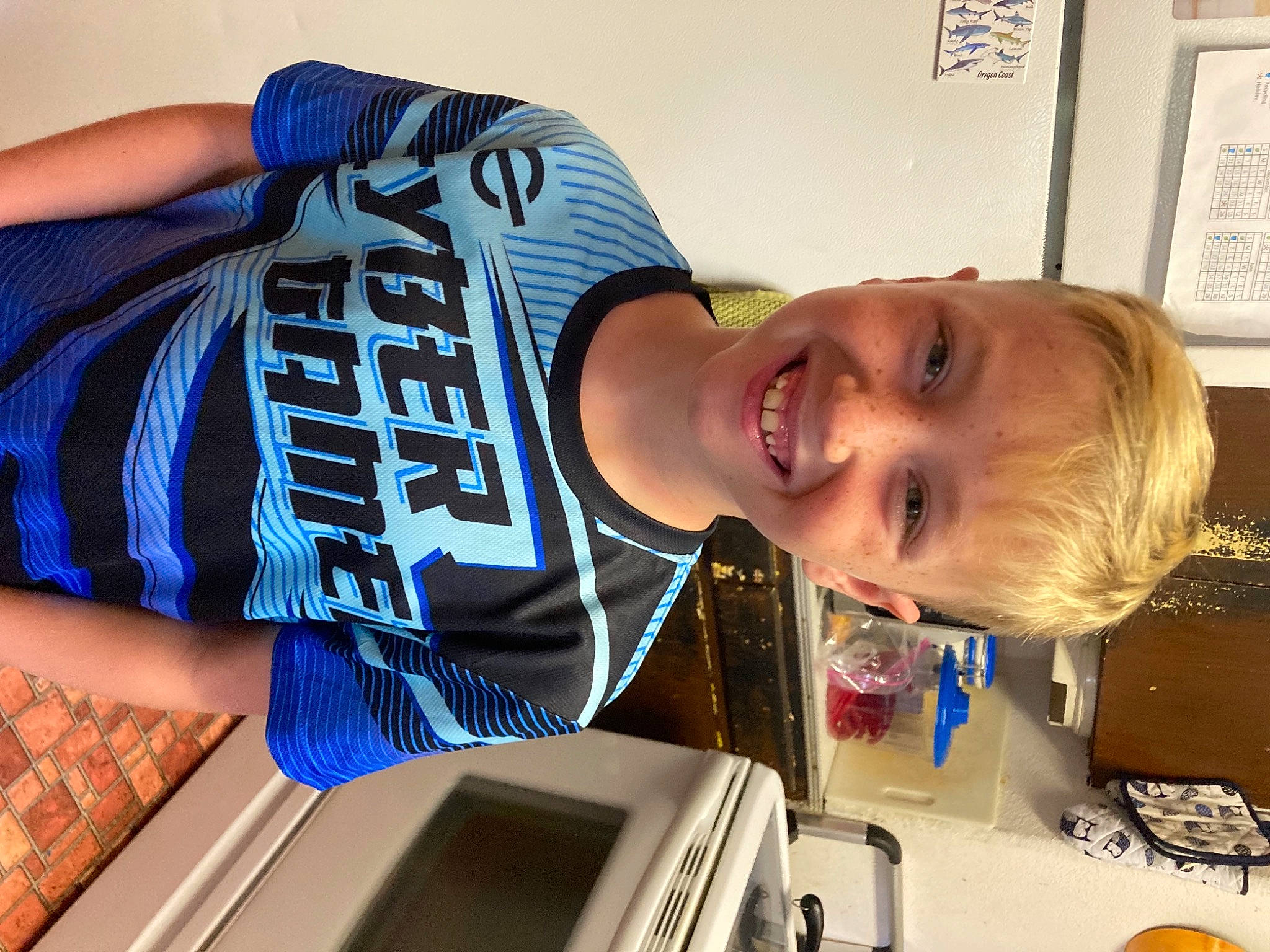 Milo is registered to the contest to win money with this photo: child, elbow, electric_blue, finger, fun, hairstyle, happy, joint, joy, muscle, person, picture_frame, shoulder, sleeve, smile, t_shirt, thigh, toddler, trunk, waist