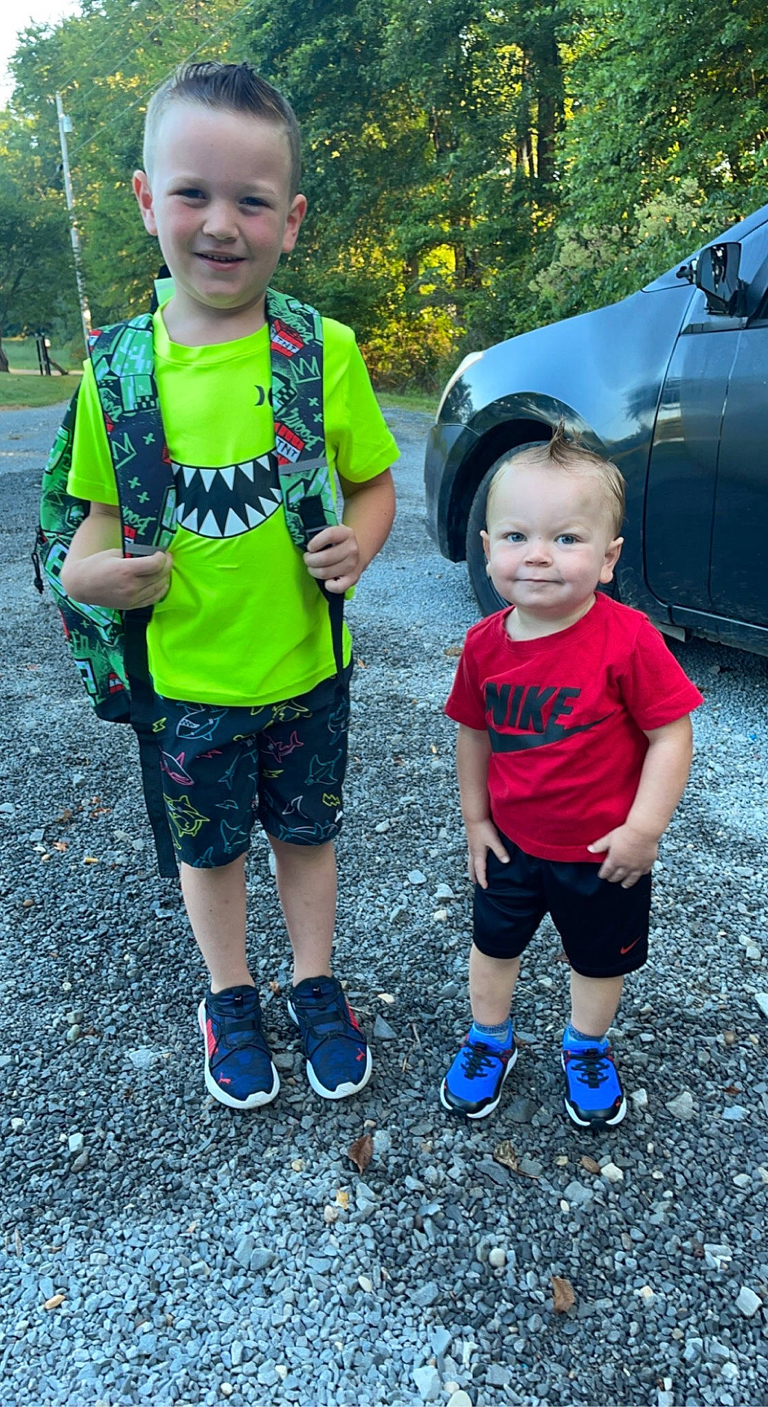 Kamron is registered to the contest to win money with this photo: car, cool, face, facial_expression, fun, grass, happy, joy, leaf, leisure, organ, people_in_nature, person, photograph, plant, shorts, smile, style, t_shirt, tire