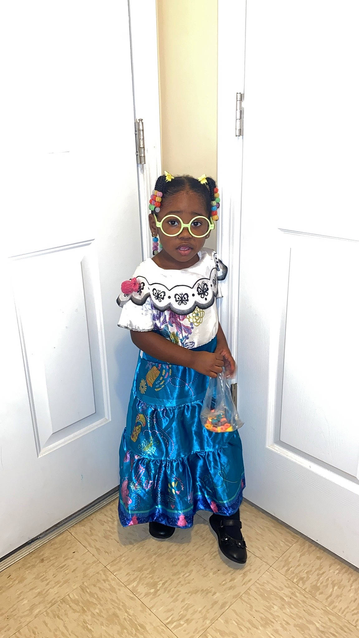Ariyana is registered to the contest to win money with this photo: art, baby_toddler_clothing, door, dress, electric_blue, event, eyewear, fashion_design, flooring, fun, goggles, outerwear, pattern, person, personal_protective_equipment, sleeve, sunglasses, toddler, vision_care, visual_arts
