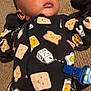 Atticus joined the competition — help win amazing prizes! baby, infant, carpet, onesie, clothing, face, pacifier, floor, pattern, milk, toast, egg, bacon, expression, cute, lying_down, young_child, indoors, portrait, sleepwear