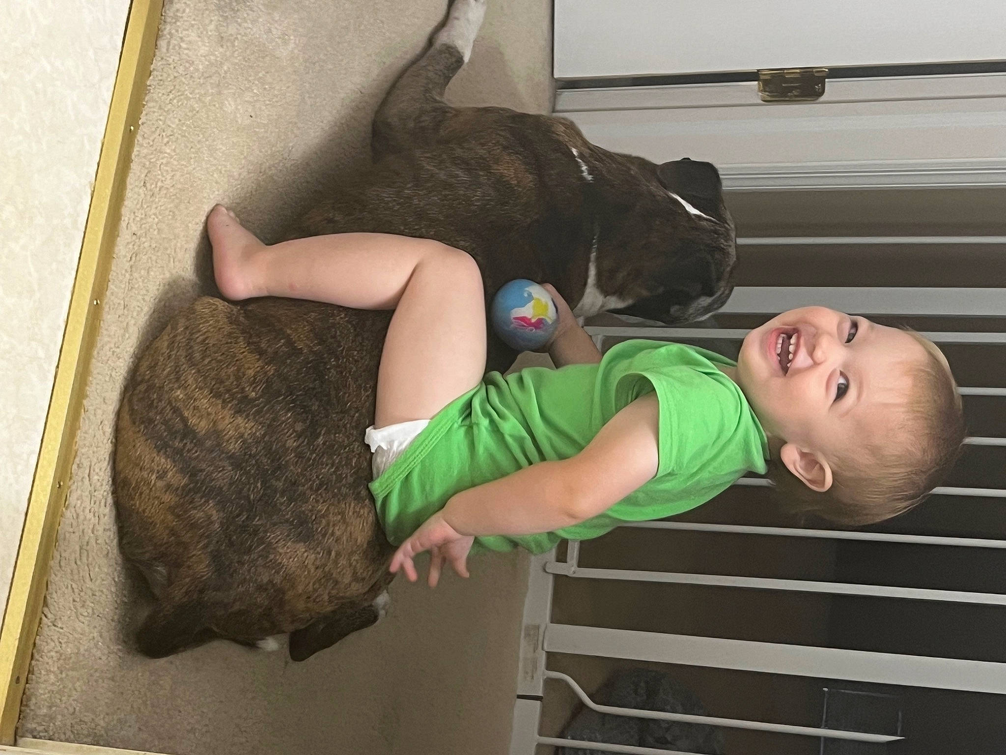 Hunter is registered to the contest to win money with this photo: baby_toddler_clothing, child, comfort, elbow, foot, fun, hat, human_body, human_leg, joint, joy, knee, leg, person, room, shoulder, sock, t_shirt, thigh, toddler