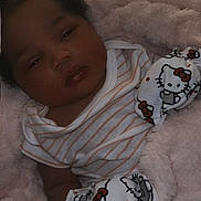 Daya Dream is registered to the contest to win money with this photo: baby, blanket, child, closeup, clothing, cozy, cute, face, head, hello_kitty, indoors, infant, mittens, portrait, resting, skin, sleepy, soft_texture, striped_onesie, young