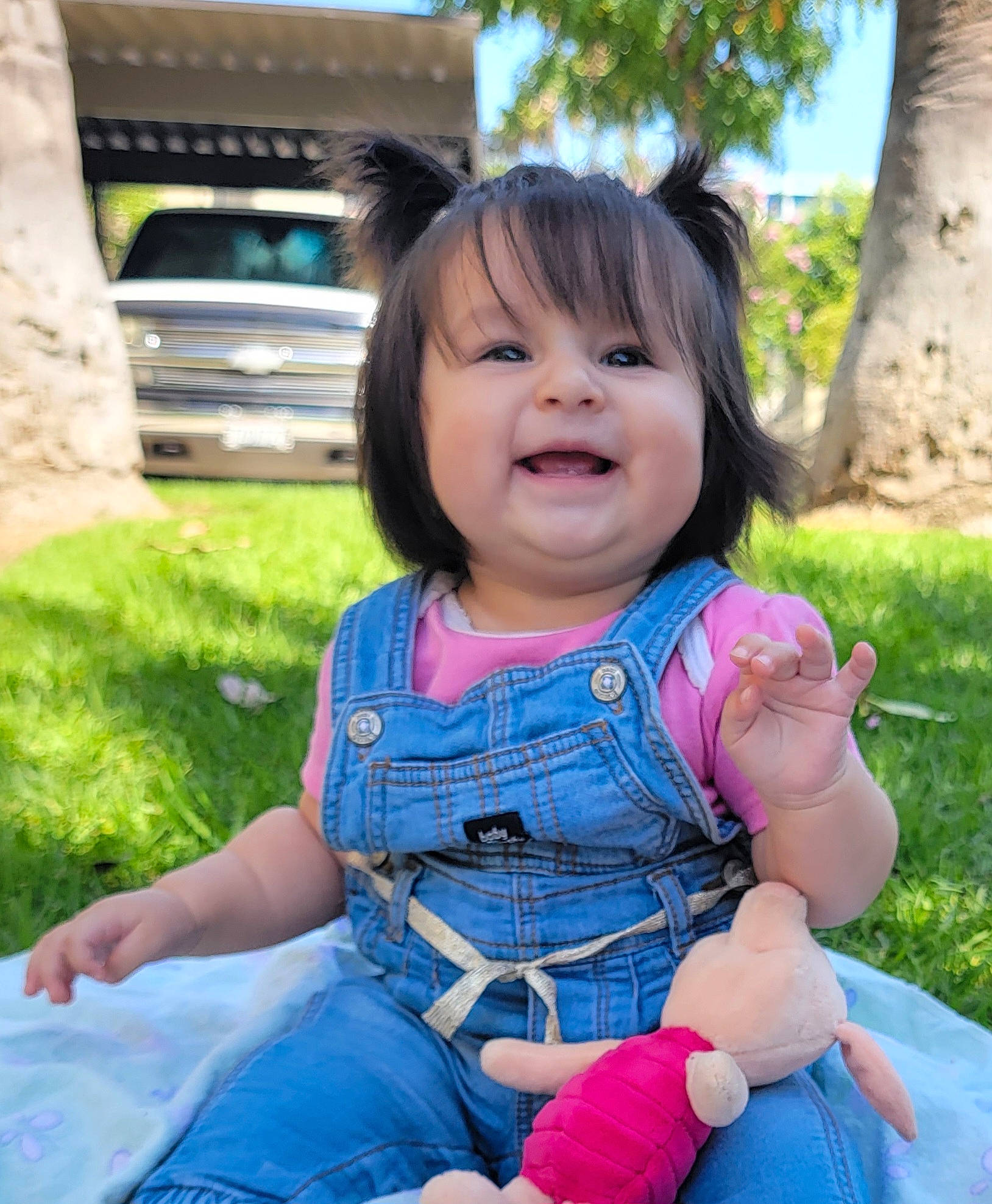 Dayana joined the competition — help win amazing prizes! baby, baby_toddler_clothing, bangs, child, denim, fun, grass, happy, joy, leisure, person, plant, play, recreation, sitting, skin, sky, smile, summer, toddler