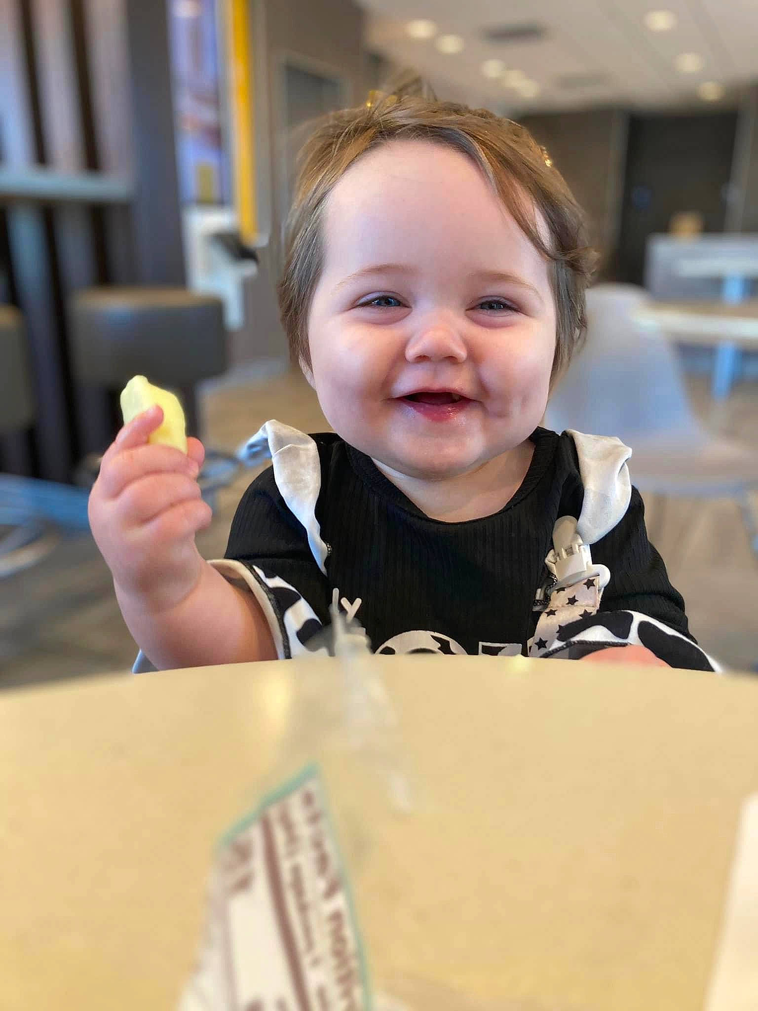 Olivia joined the competition — help win amazing prizes! baby, chair, cheek, child, curtain, event, fun, gesture, happy, joy, laugh, person, room, sitting, skin, smile, t_shirt, table, tableware, thumb