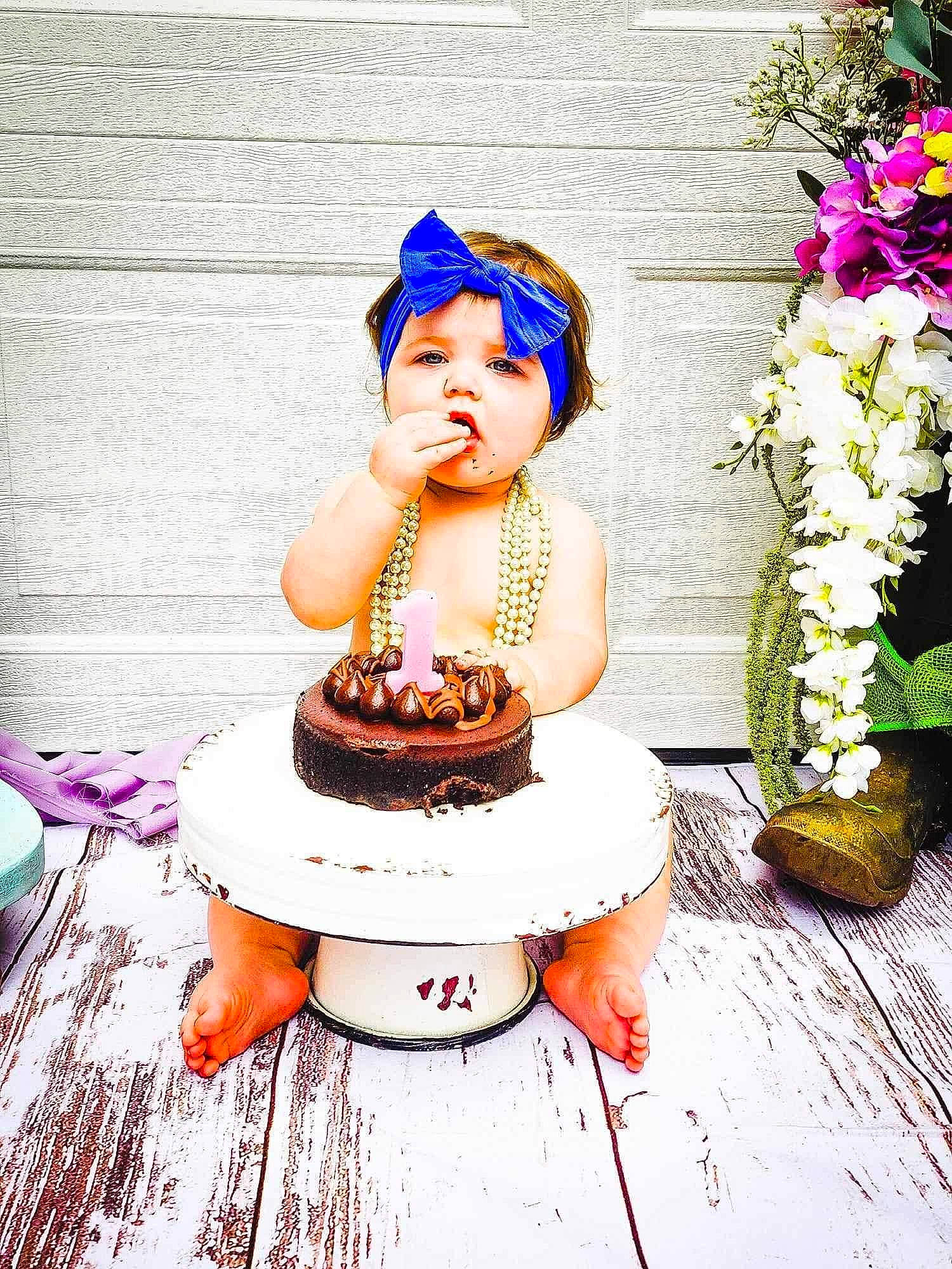 Olivia is registered to the contest to win money with this photo: baked_goods, birthday_cake, cake, cake_decorating, cake_decorating_supply, cake_stand, cuisine, dress, event, flower, food, happy, hat, icing, person, petal, pink, plant, sugar_cake, table