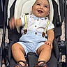 baby, child, stroller, smiling, happy, portrait, bow_tie, suspenders, white_shirt, blue_clothing, sandals, seated, infant, outdoor, playful, laughing, face, carriage, baby_gear, photography