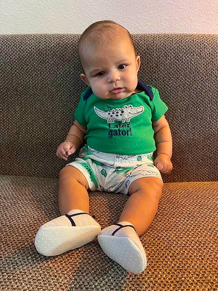 Aiden joined the competition — help win amazing prizes! baby, baby_toddler_clothing, barefoot, cheek, child, eye, foot, happy, human_body, human_leg, knee, neck, pattern, person, sitting, sleeve, sock, t_shirt, thigh, toddler